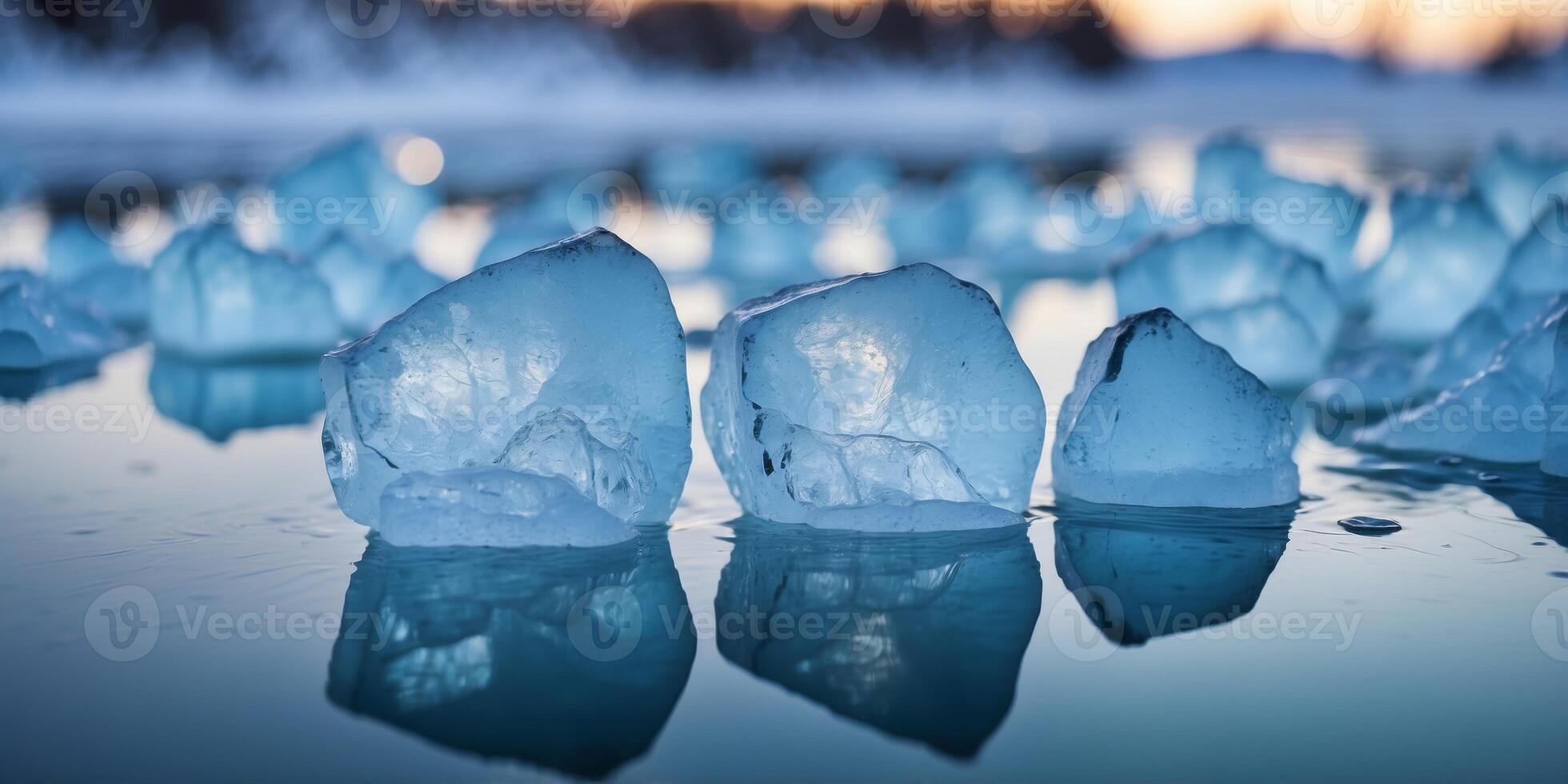 Cracked blue ice with clear water beneath at a frozen lake during winter. photo