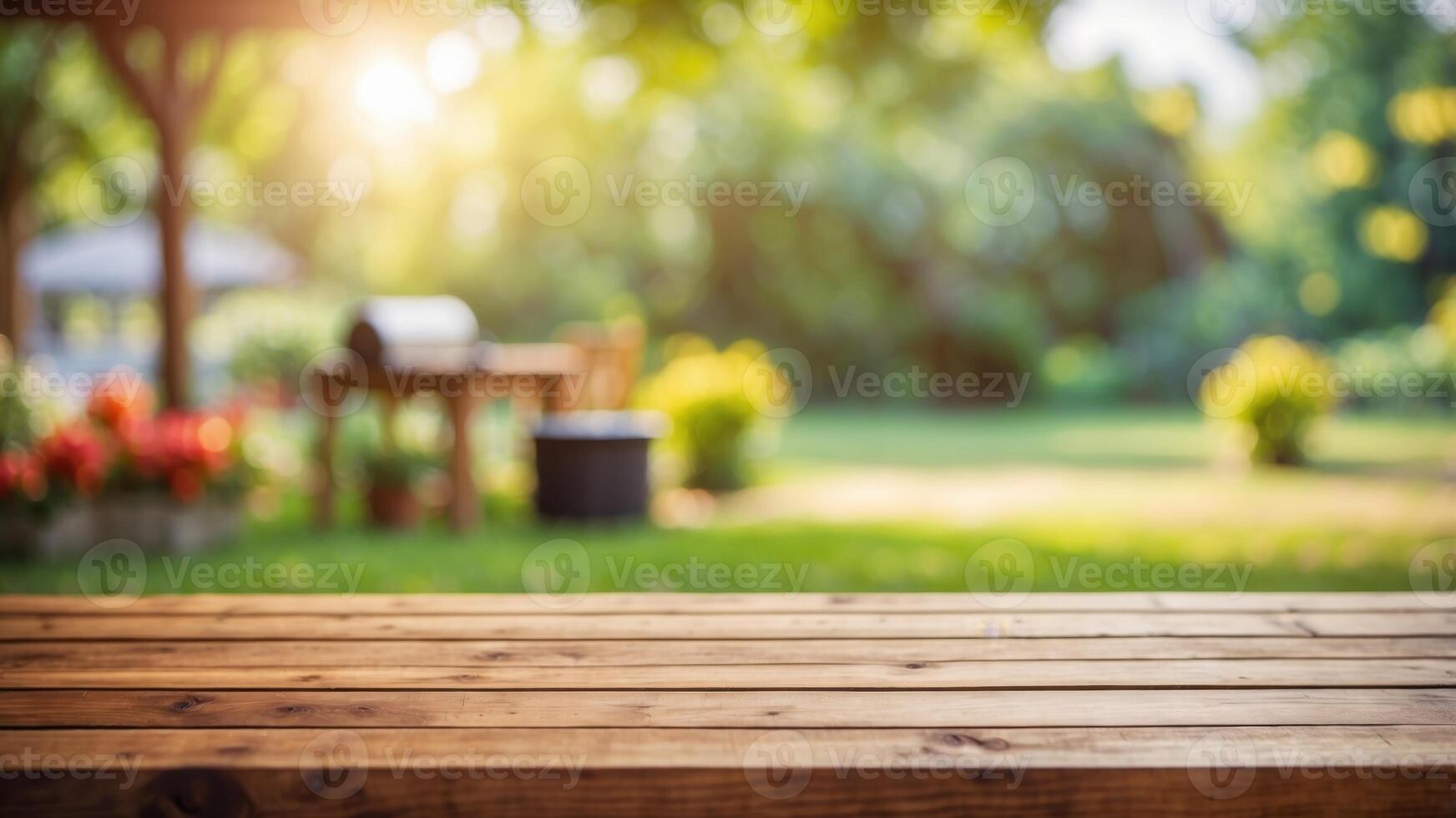 empty wooden table on blurred garden background with barbecue grill in summer. photo