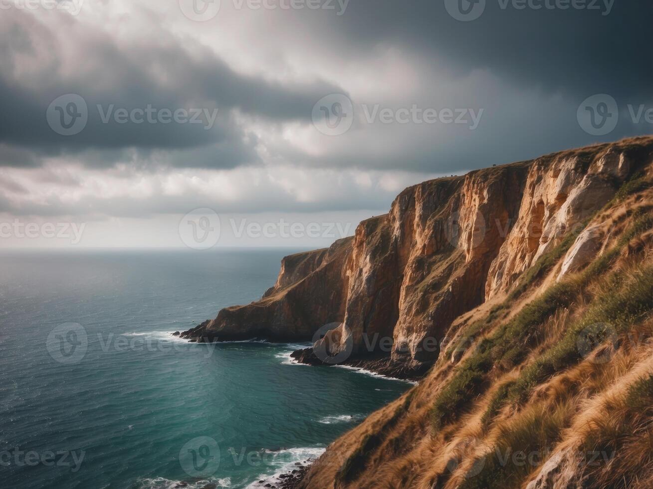 Coastal Cliffs and a Tranquil Sea Under a Cloudy Sky. photo
