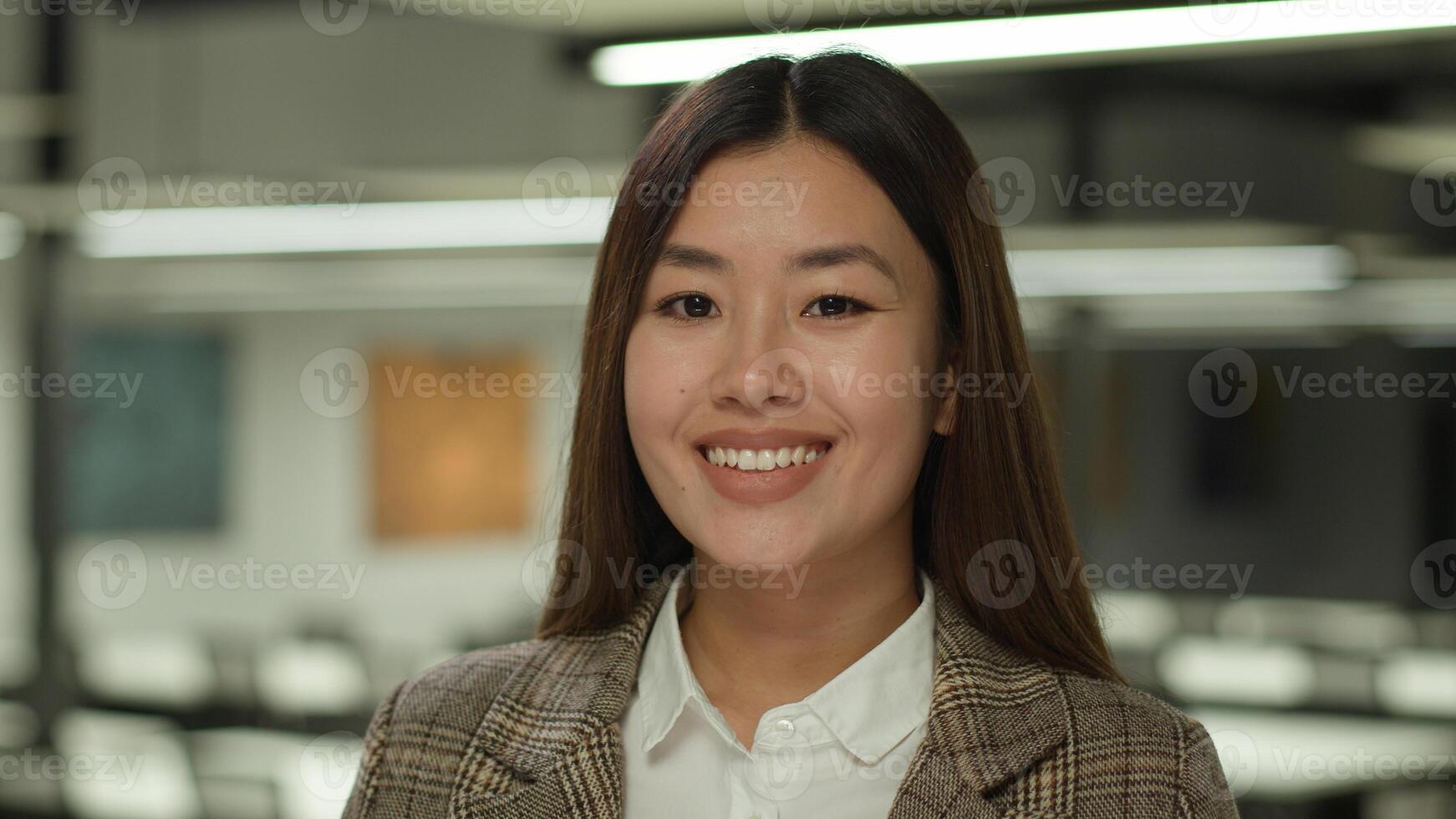 Portrait happy smiling positive Asian woman business manager worker female employer entrepreneur Chinese businesswoman Japanese student girl Korean saleswoman smile in office at camera healthy face photo
