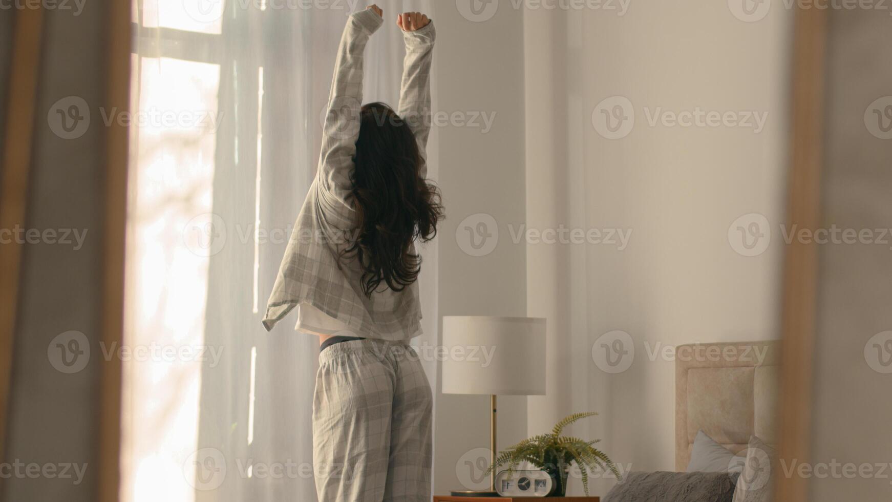 Caucasian woman get out bed awake new sunny day satisfied female stretching looking window good morning bedroom comfortable cozy relax girl hotel energy daylight active refreshing weekend home pulling photo