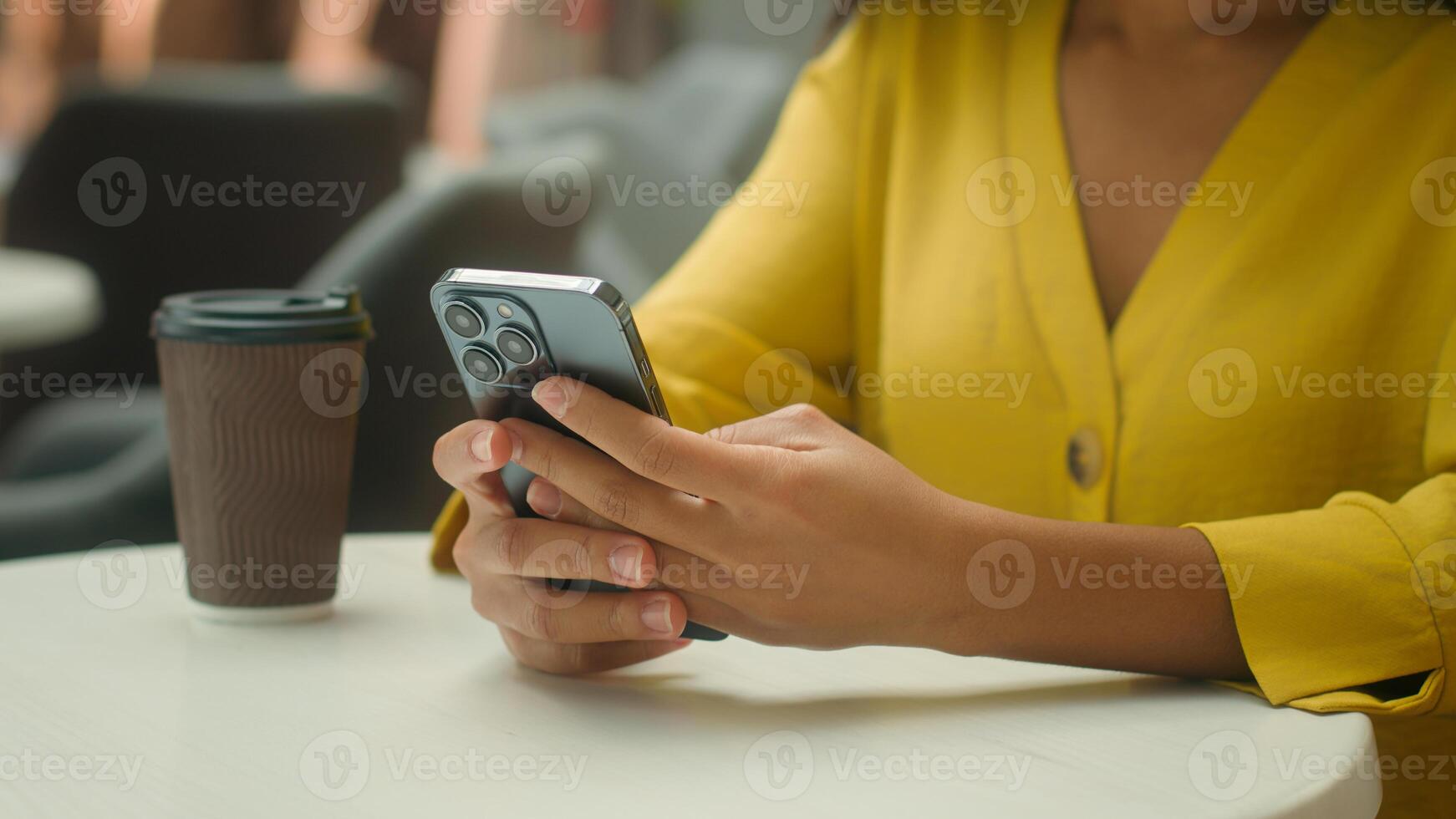 Close up hands African American woman holding smartphone mobile phone telephone cellphone texting sms online order buyer customer client girl female smile pleasure chatting coffe takeaway ecommerce photo