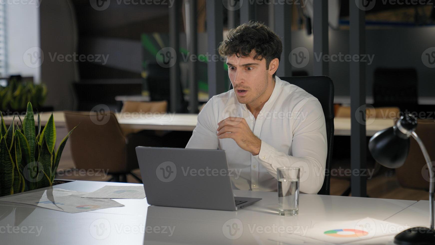 Shocked Caucasian businessman with laptop failure in office business man shock problem fail lose online trouble company crisis male professional computer stress worker bankrupt browsing pc crash error photo