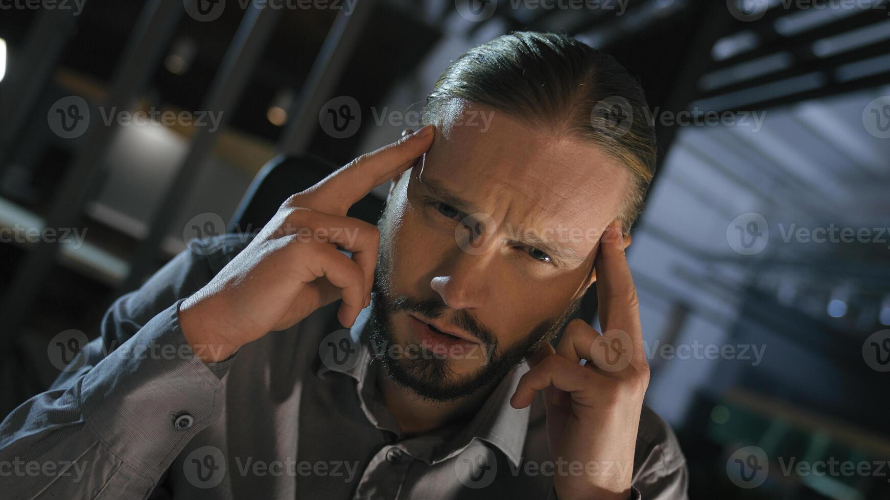 Moving rotating whirl camera move sad upset unwell ill sick bad feeling Caucasian businessman stressed business man overworked overload overtime stress migraine think pain dizzy headache head thinking photo