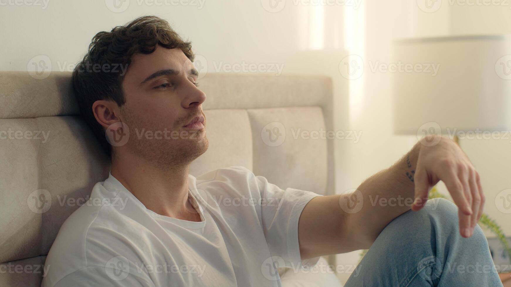 Caucasian European man pensive thoughtful thinking sadness bored bedroom bed home male tired guy failure grief loneliness upset sigh contemplation boredom reflection solitude frustration exhaustion photo