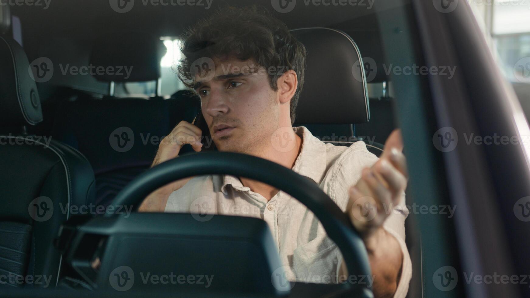 Dissatisfied annoyed irritated angry tired stressed Caucasian business man driver male guy driving electric car talking mobile phone call problem conflict quarrel speaking smartphone inside automobile photo