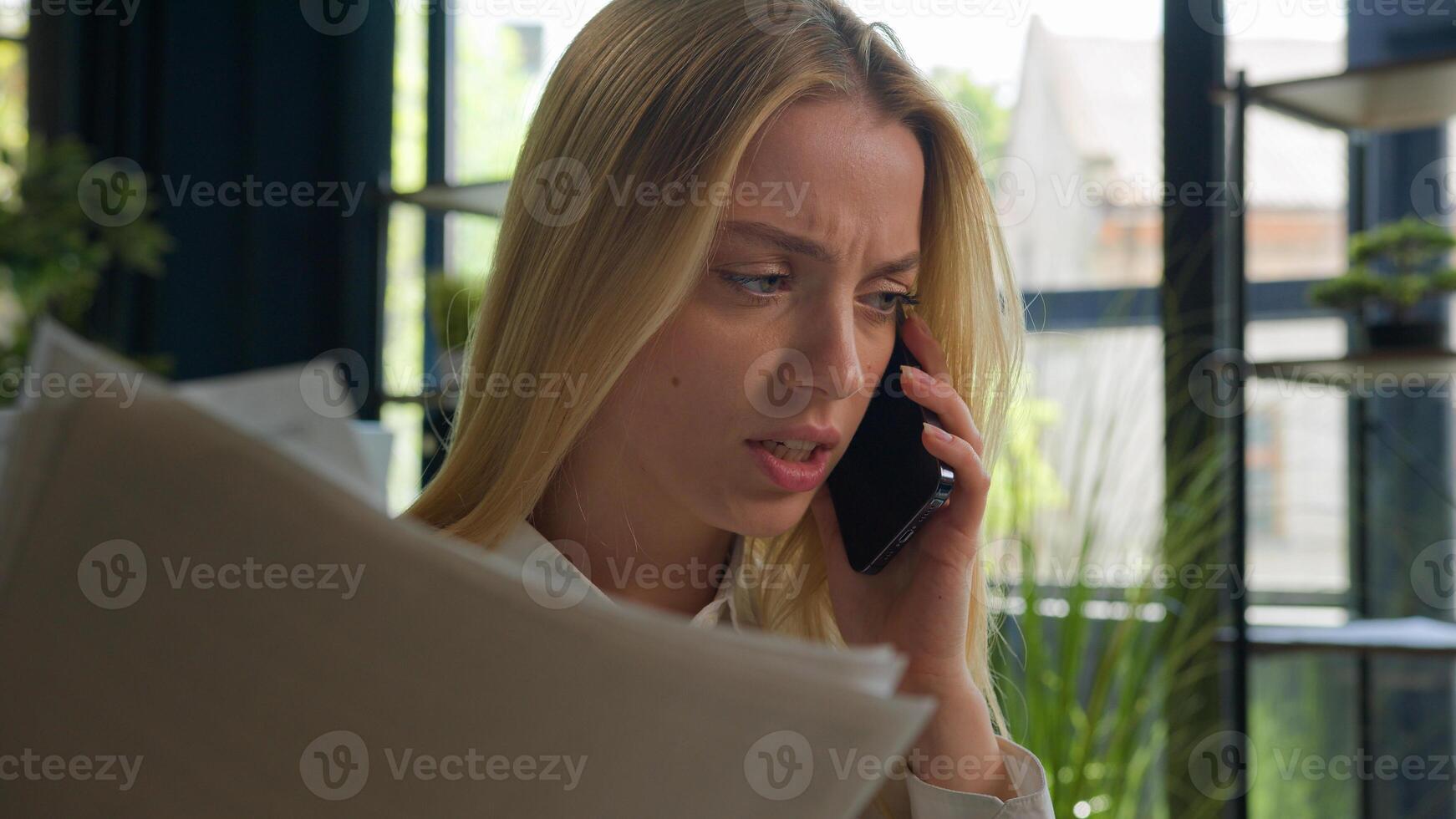 Caucasian businesswoman talk mobile phone arguing negative emotion dissatisfied wrong business contract financial report documents mistake stressed angry entrepreneur girl woman call smartphone shout photo