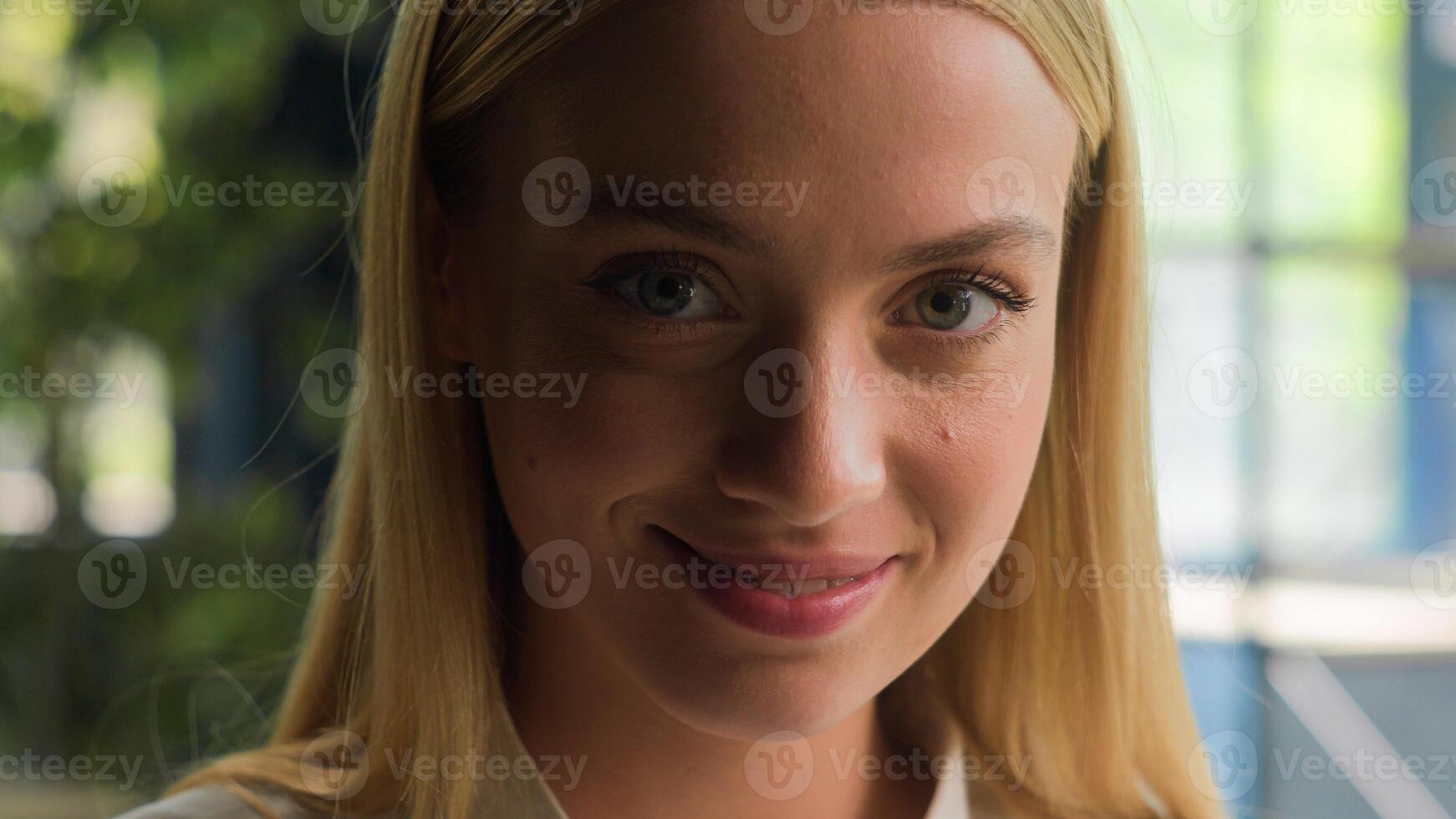 Close up face beautiful Caucasian young girl charming woman student businesswoman business entrepreneur office secretary lady with natural makeup seductive look at camera flirt smile feminine portrait photo