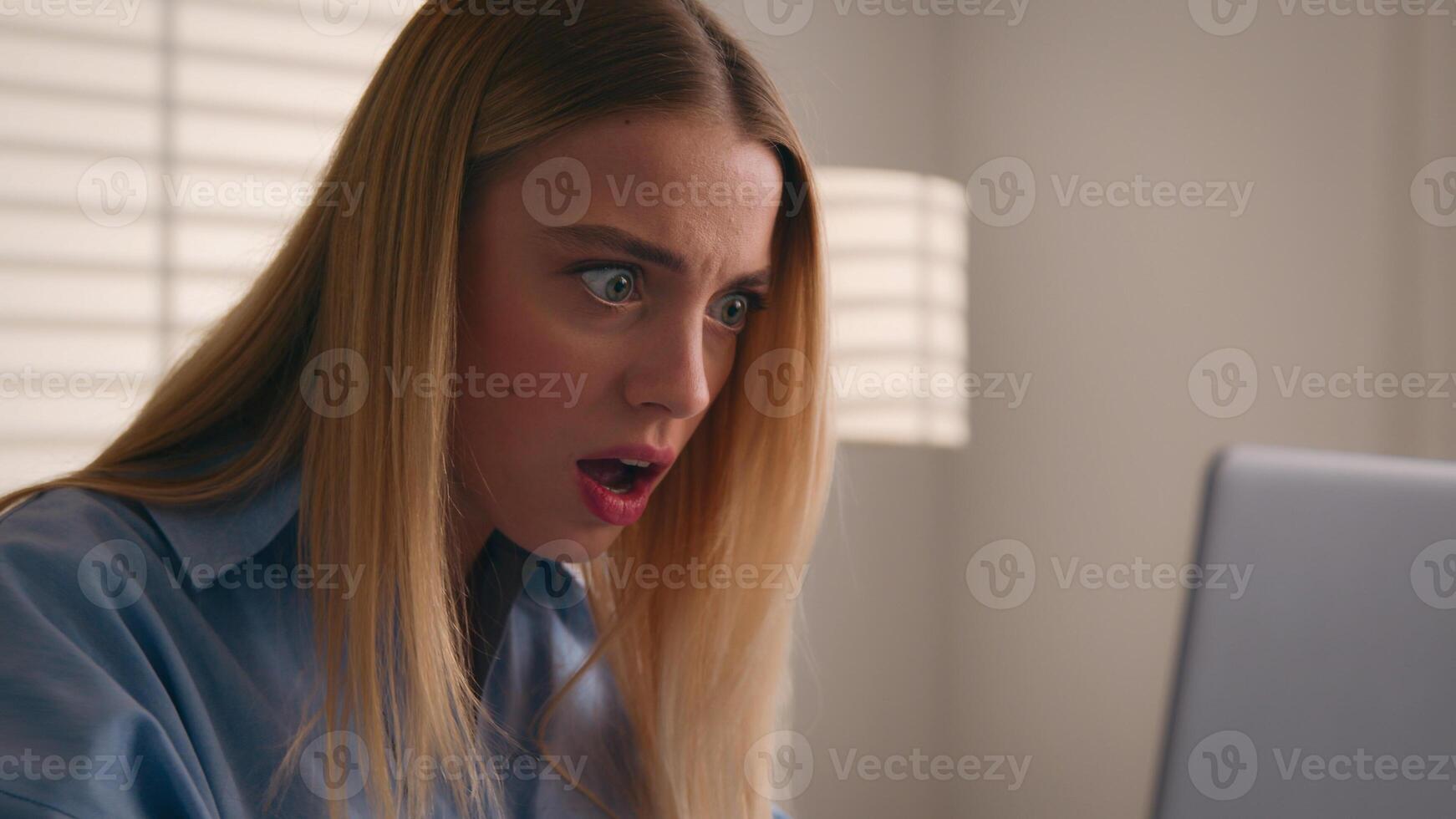 Close up angry upset Caucasian woman user using laptop in home office frustrated mad confused shocked computer problem say what shock failure online stressed girl businesswoman mistake software error photo