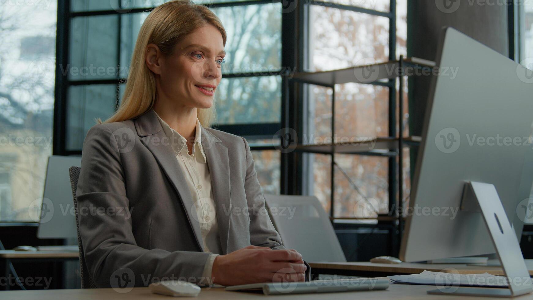 Caucasian adult woman office worker distant consultant middle-aged businesswoman CEO talking by computer call application consultation client remote communicate with colleagues online conference photo