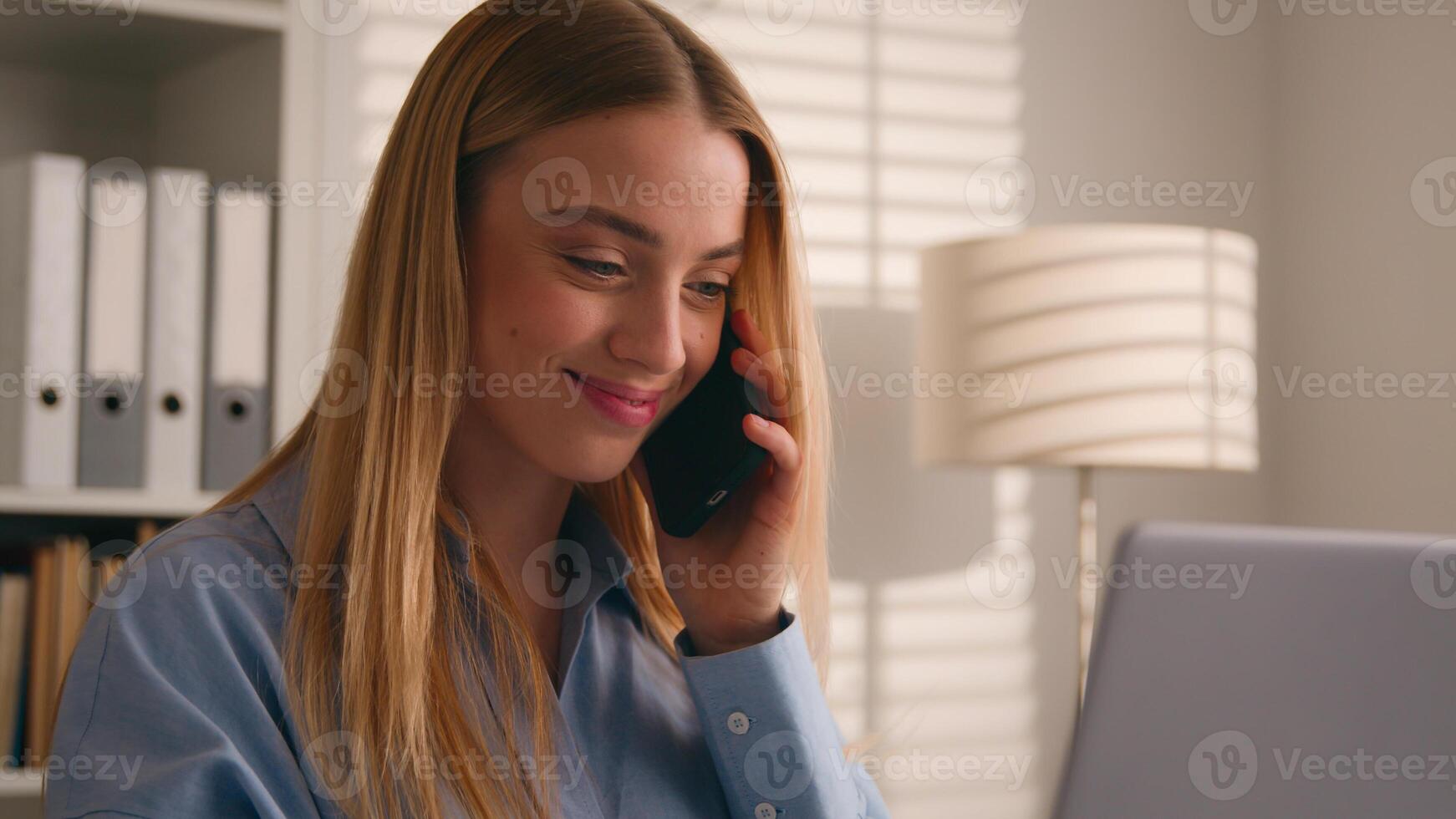 Caucasian girl talk to client on cellphone use laptop discuss deal woman businesswoman consultant agent at home office working with computer make order consultation support customer talking phone call photo