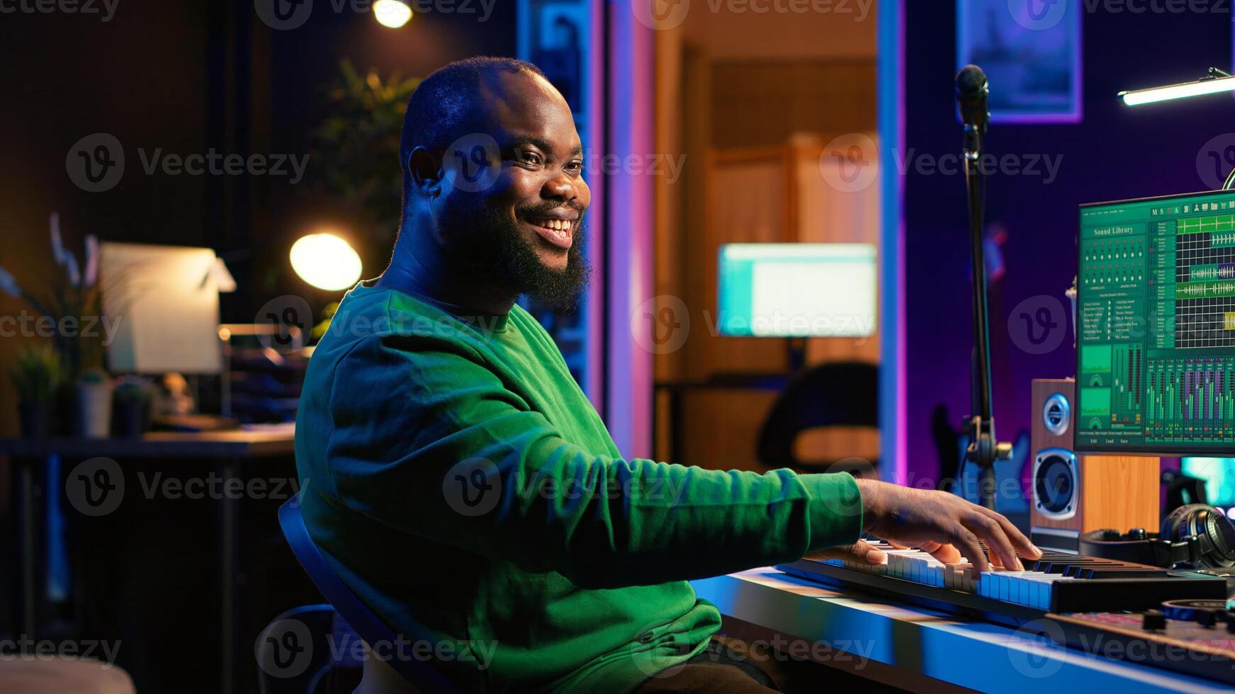 Modern producer playing piano keys to record new soundtrack, trying to produce song using midi controller electronic keyboard. Songwriter composer playing instrument notes to create tunes. Camera A. photo