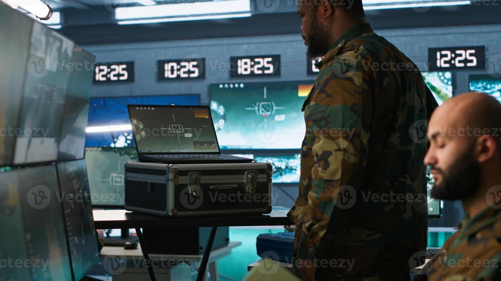 Military officer using tracking software to be able to offer info to front lines commander. Army expert doing reconnaissance to gain intel helping troops, coordinating mission activities, camera A photo