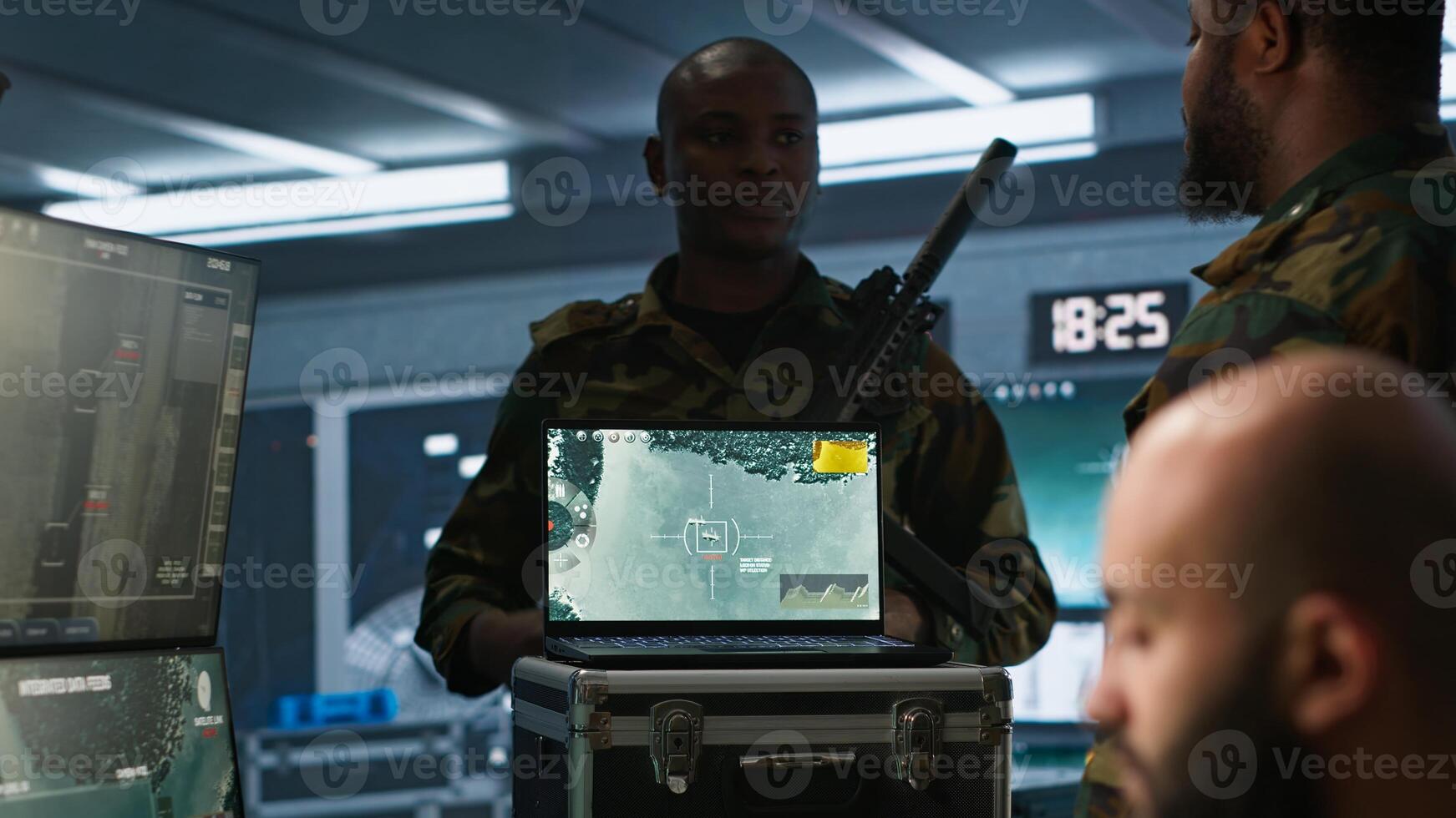 Military soldier wearing camo uniform in mission control center, overseeing national safety operations using laptop. Army expert examining data in monitoring room command center, camera A photo