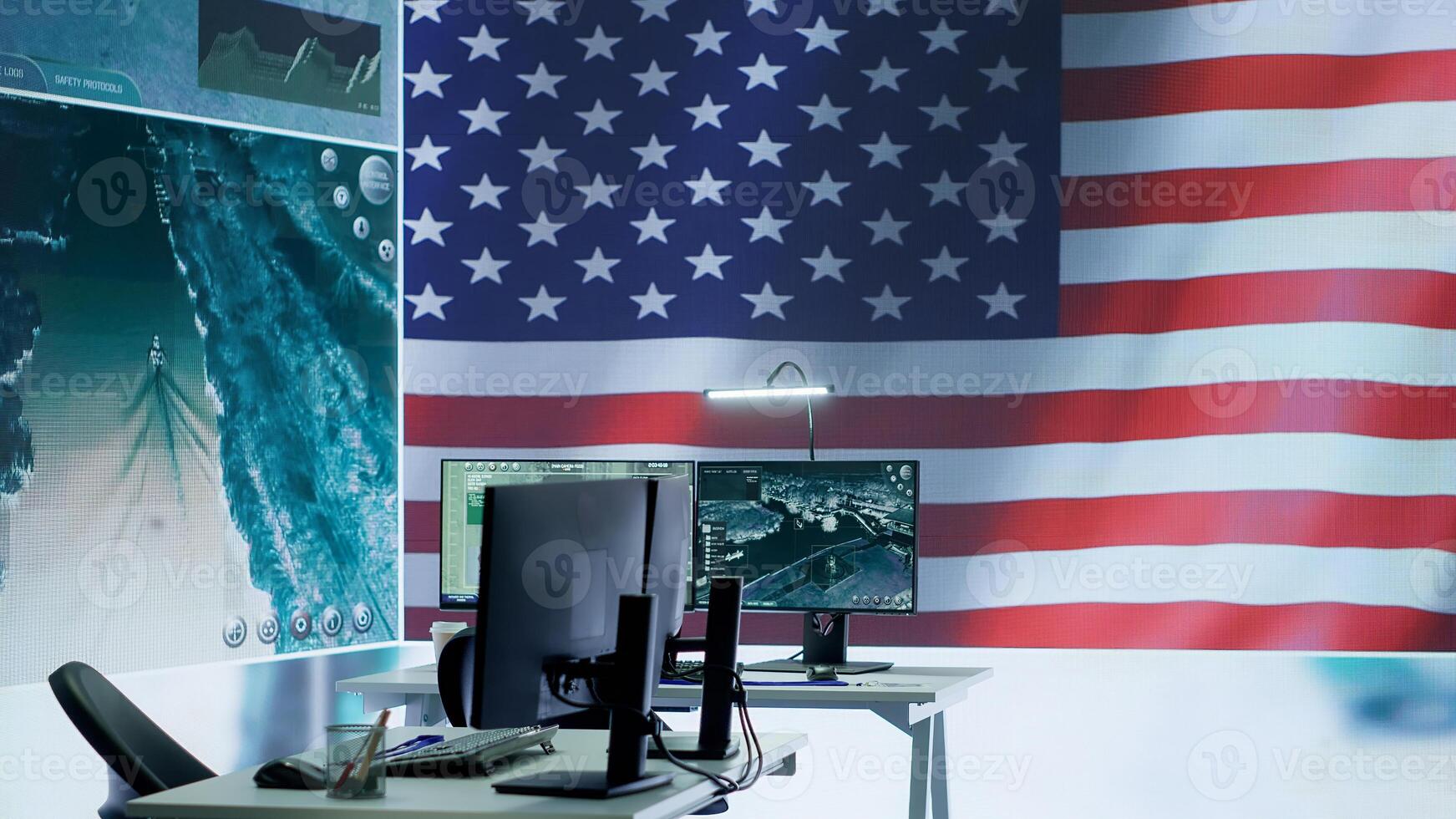 Empty operations center with an American flag working on national safety, armed forces protecting the country with anti terrorism tactics. Military control and command room headquarters. Camera A. photo