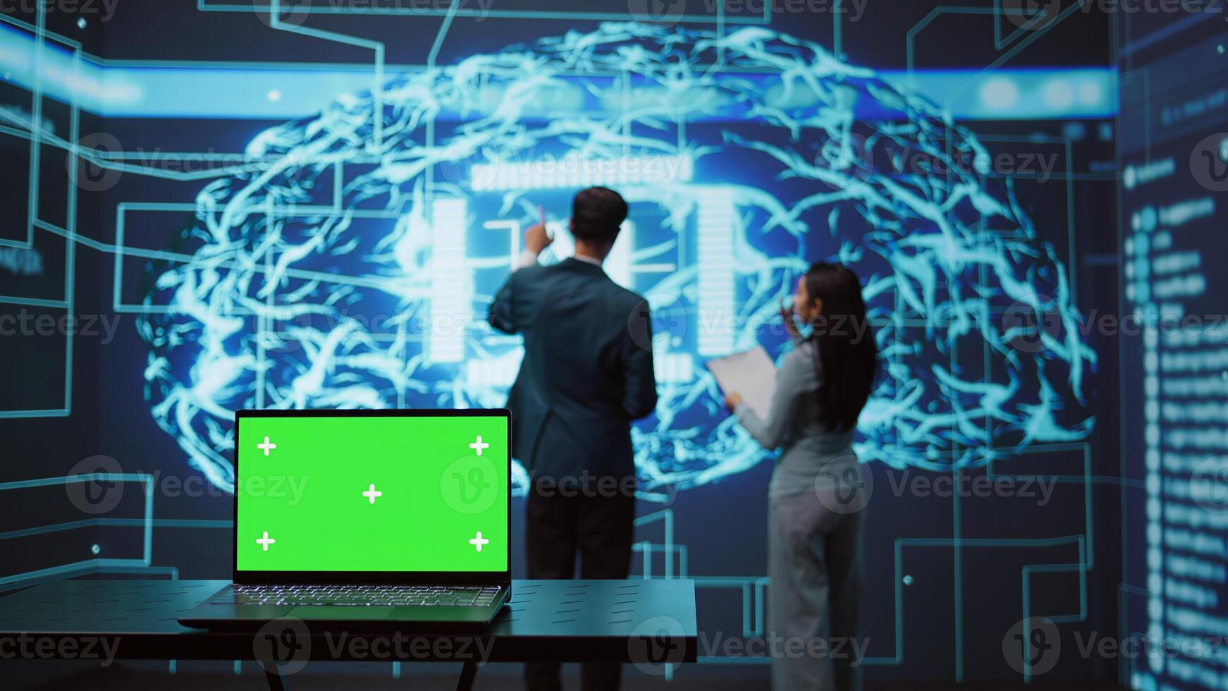 Teamworking AI technicians using green screen laptop for business data analysis. Team of IT experts works on mockup notebook to automatize tasks using artificial intelligence, camera B photo