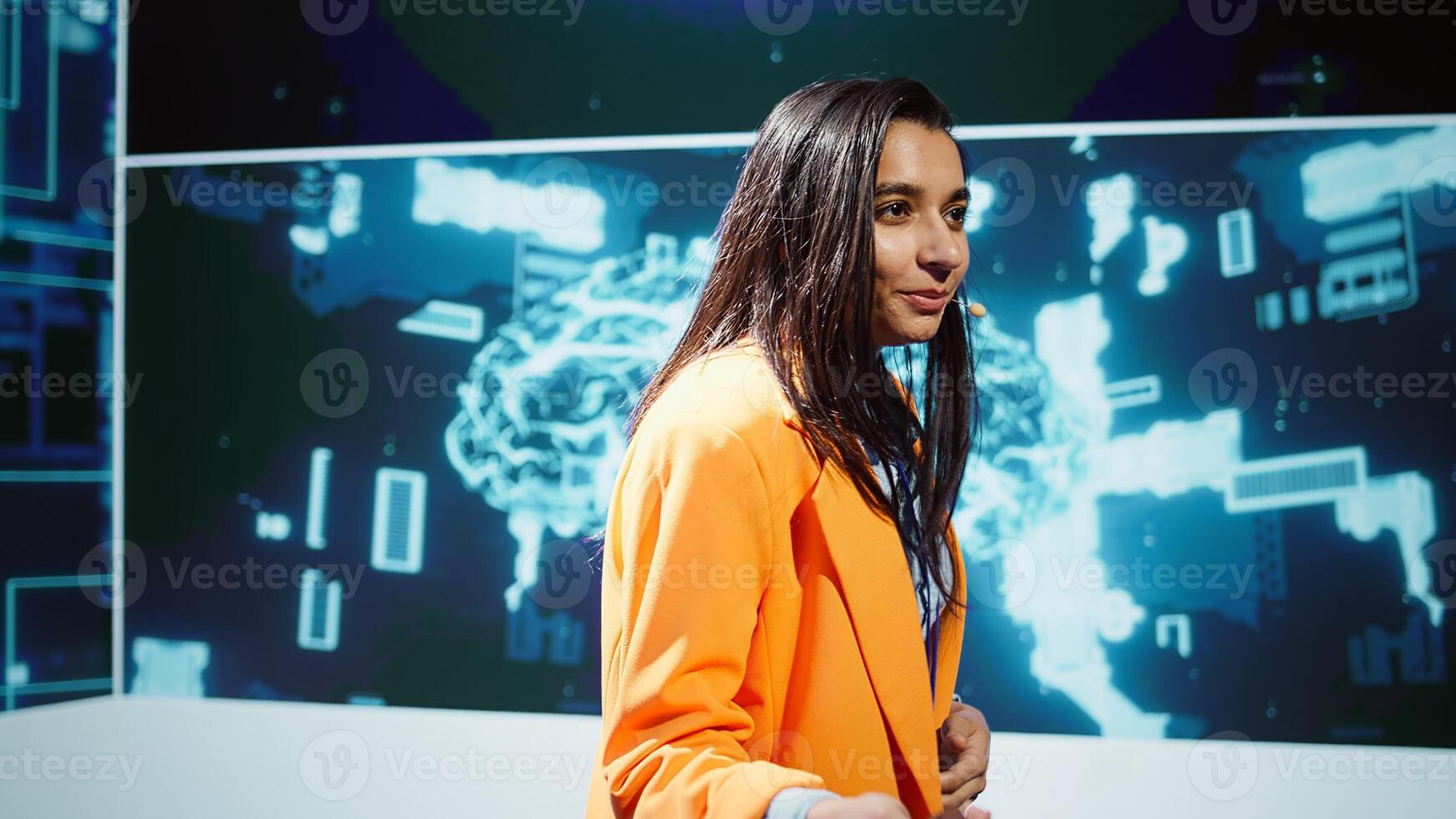 Upbeat presenters speak at AI forum gathering tech startups managers, investors and academics. IT specialists moderating discussion panels helping companies tap into artificial intelligence, camera B photo