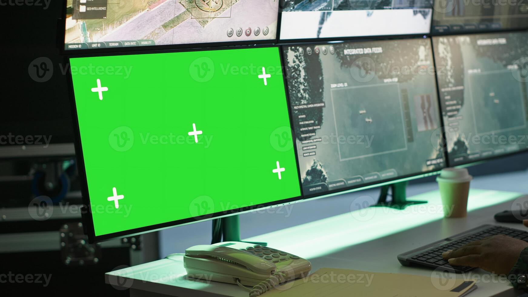 Soldier in military HQ base using green screen equipment to gather information on enemy troops. Officer using chroma key devices to do assessment of enemy vulnerabilities, camera A photo