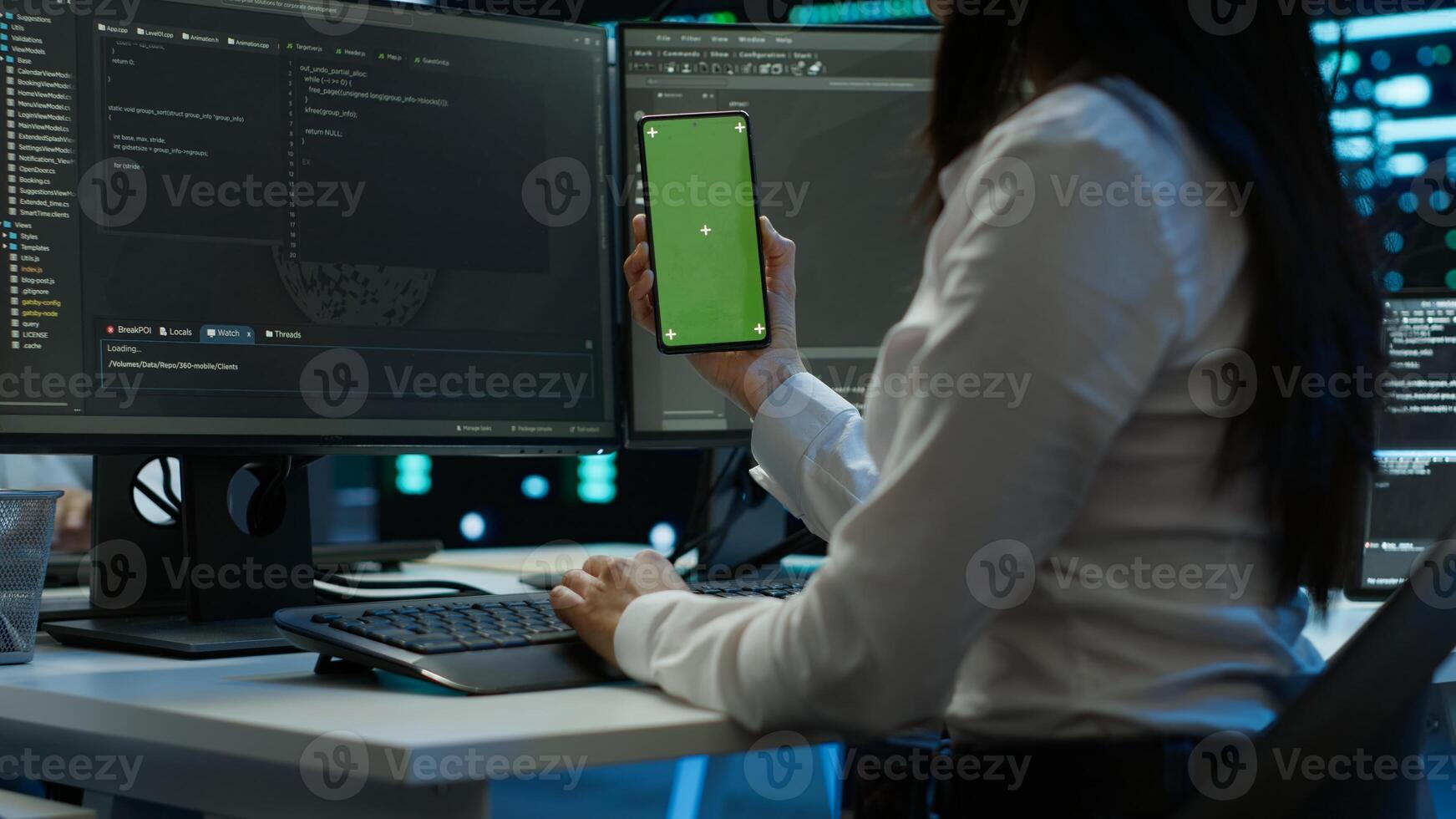 Worker overseeing data center using green screen mobile phone, ensuring system can handle networking tasks. IT expert in server room tracking network traffic with empty copy space smartphone, camera A photo