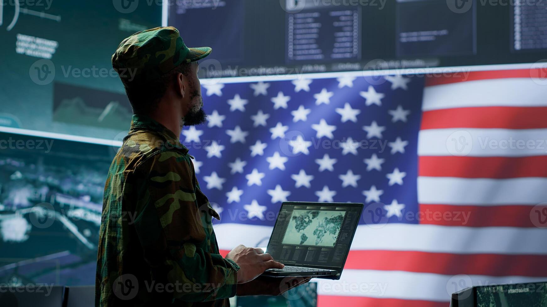 US soldiers operating in a high tech cybersecurity command post, managing state secrets and classified information. Protecting servers against digital threats and cyber warfare. Camera A. photo
