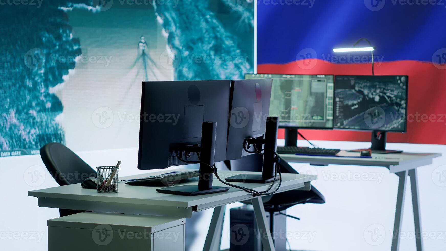 Empty army command post with the russian flag running on big screen, russian federation and government working on propaganda to spread fake news among the population. Camera A. photo