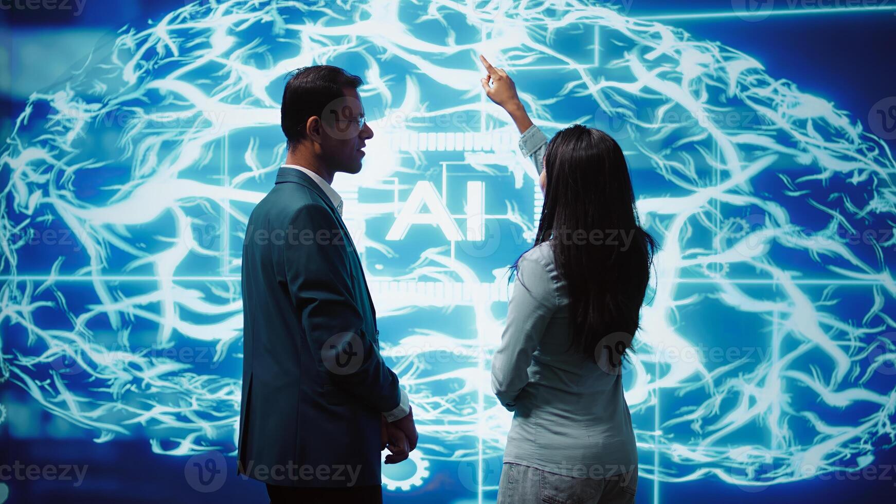 Teamworking colleagues implementing artificial intelligence parallel processing, breaking up complex computational tasks enabling AI systems to process more input data faster, camera B photo