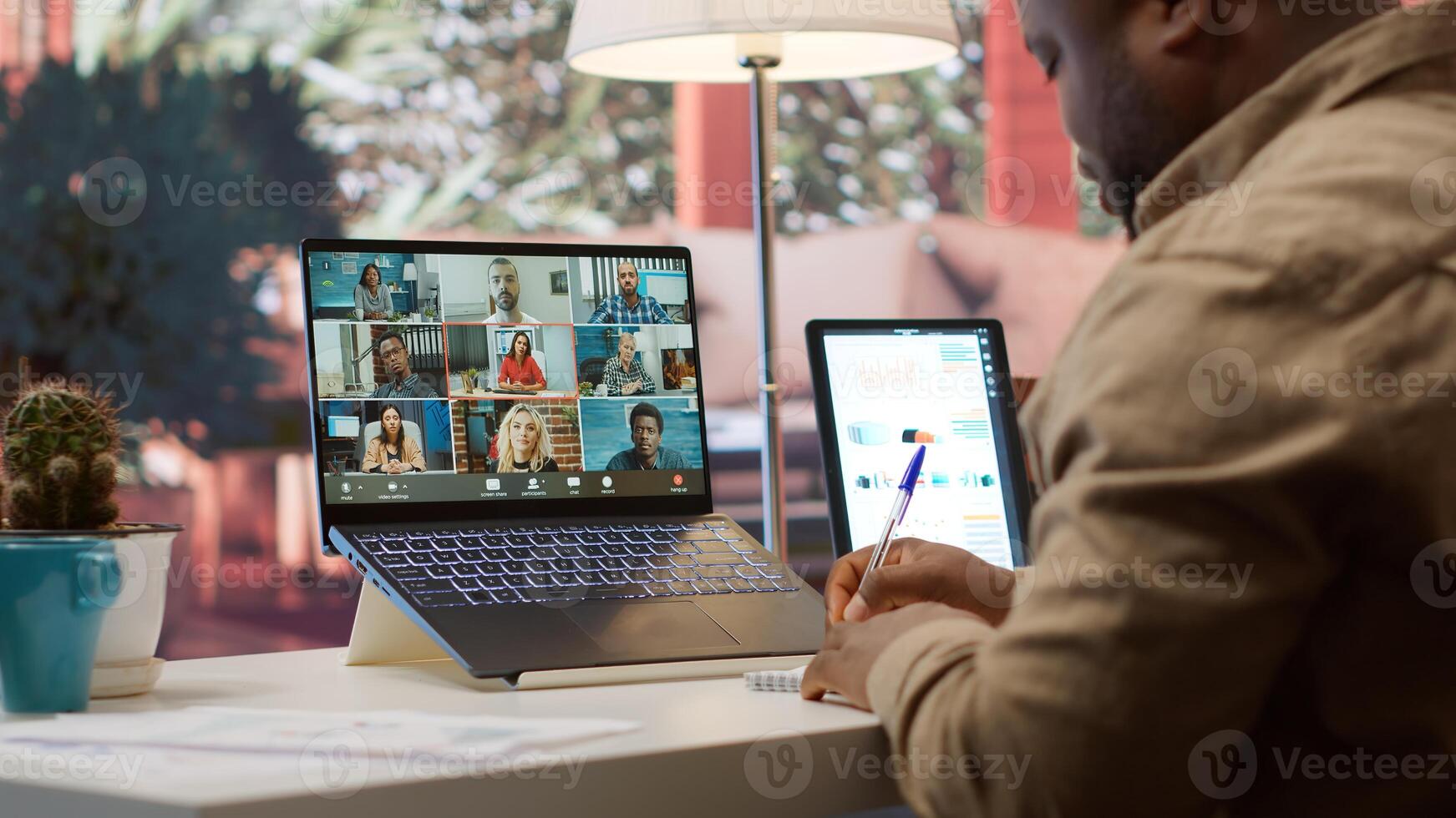 Businessman presents annual sales reports to the shareholders on videocall, working from home to increase funding. Entrepreneur making a development presentation for the investors. Camera A. photo