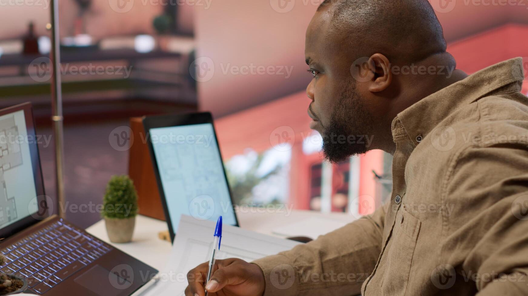 Corporate owner measuring and evaluating office blueprints and architectural sketches, working on strategy planning for a modern and professional workspace design. Relocate office space. Camera A. photo