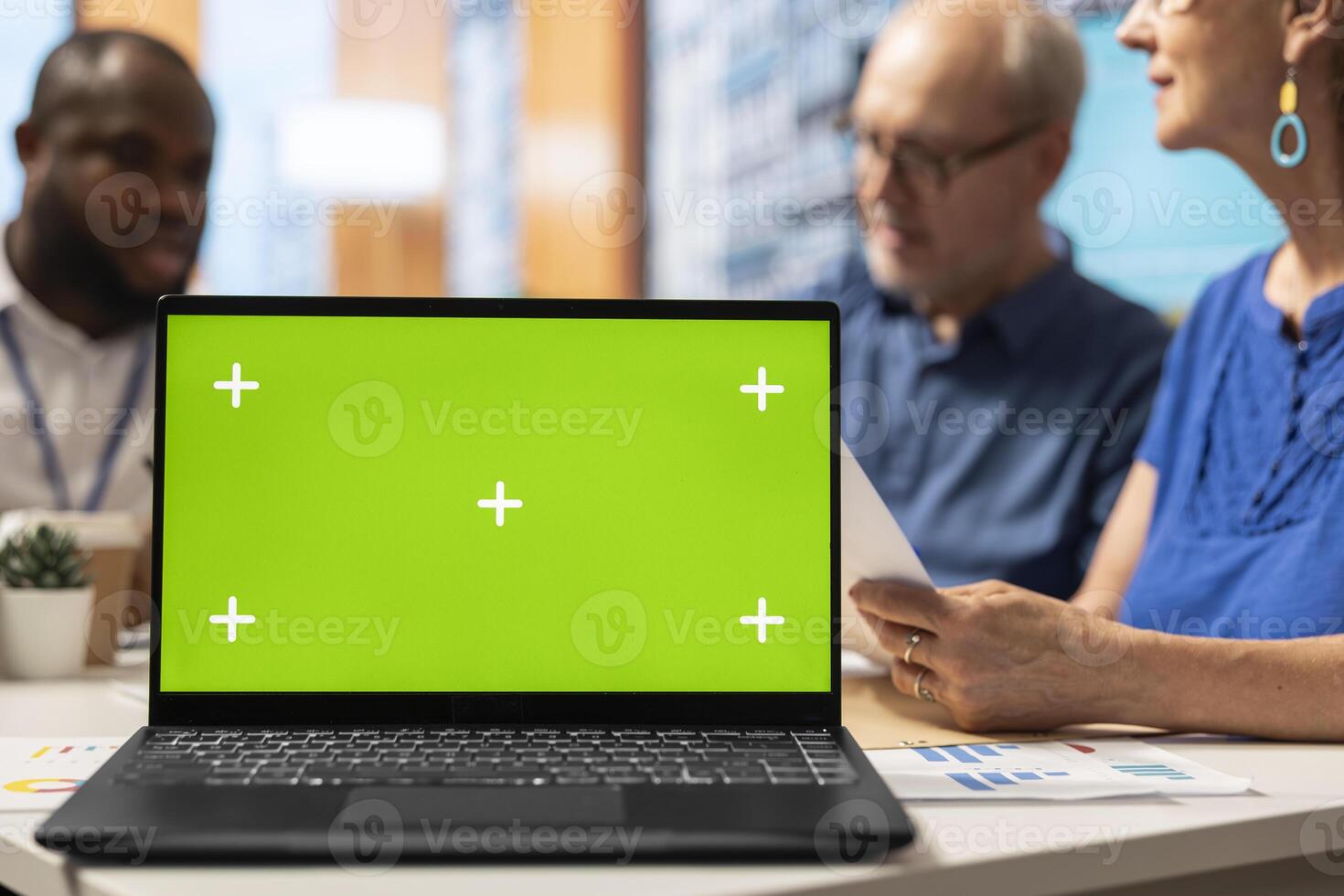 Financial advisor and old clients exploring retirement plans options next to isolated copy space on laptop to ensure stability for retired people. Broker offering his professional advice. photo