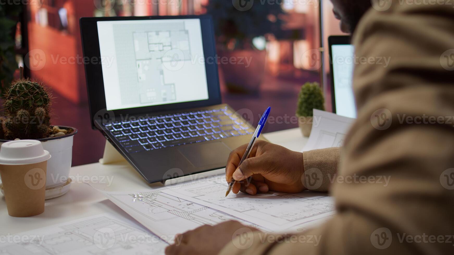 Corporate owner measuring and evaluating office blueprints and architectural sketches, working on strategy planning for a modern and professional workspace design. Relocate office space. Camera B. photo