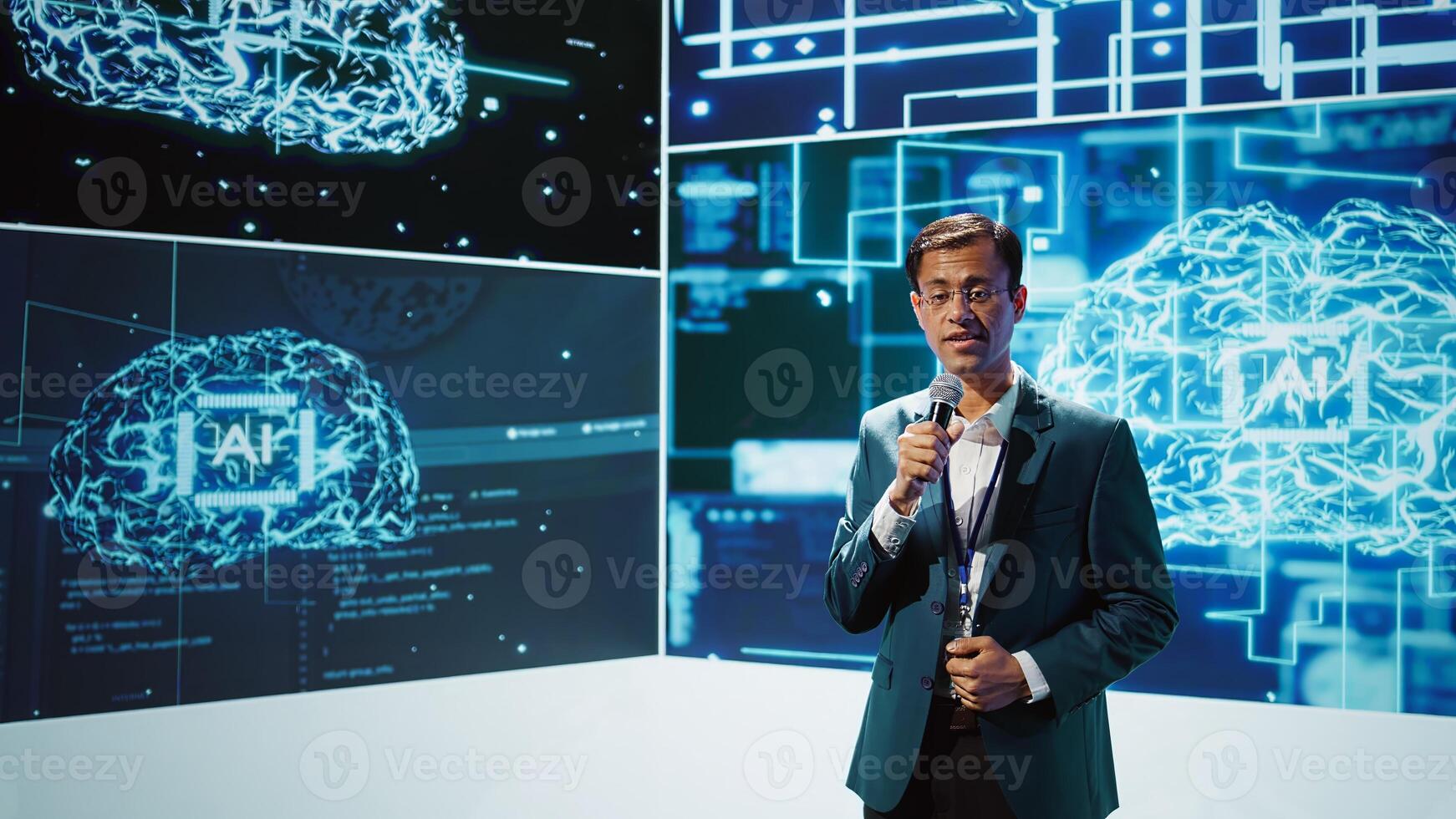 Presenter talking with spectators at AI convention bringing together IT specialists, sharing insights from latest developments in artificial intelligence and cognitive computing, camera B photo