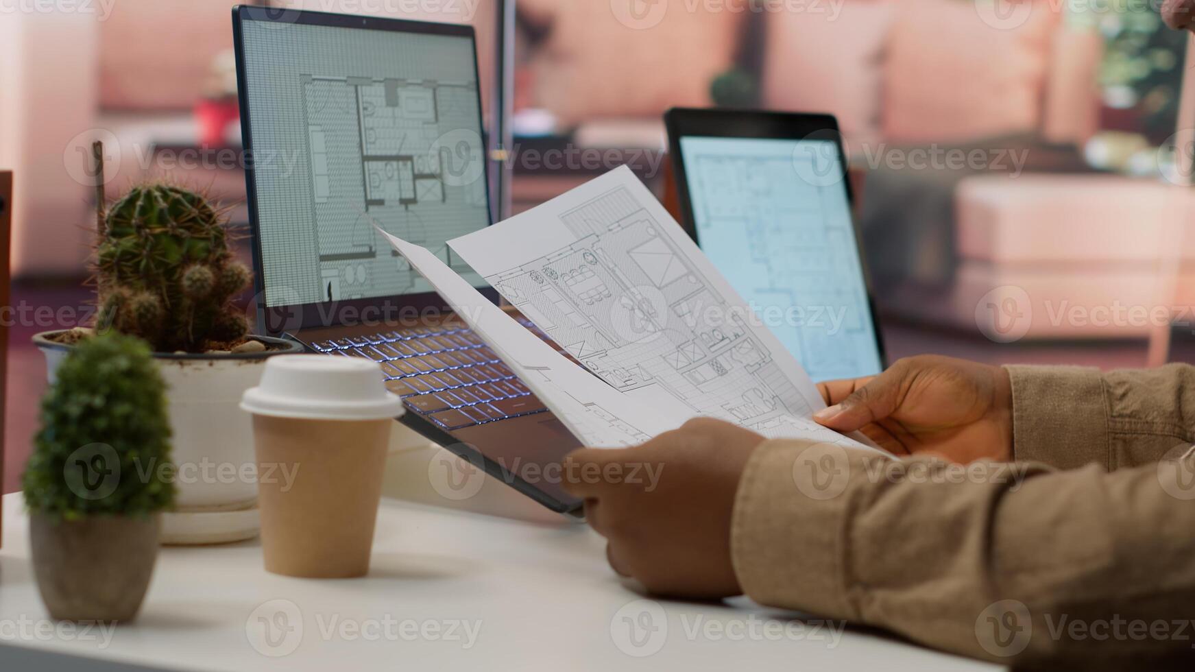 Professional entrepreneur examining blueprints and using digital tools for office space planning and development. Business owner workspace design for renting, investment strategy. Camera A. photo