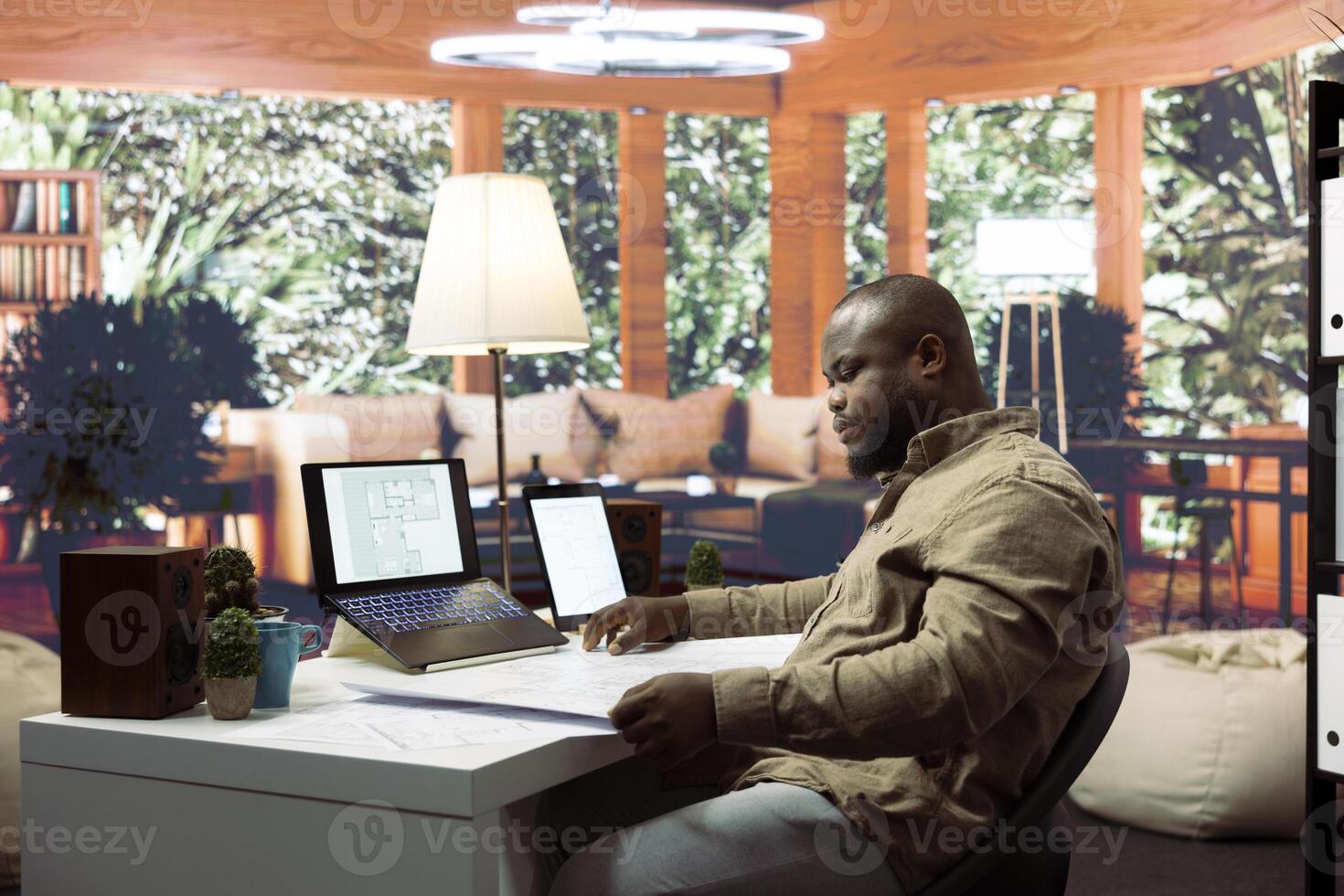 Entrepreneur evaluating office blueprints and planning the interior design for the new business workspace. Reviewing architectural layout sketches, real estate leasing strategy. photo