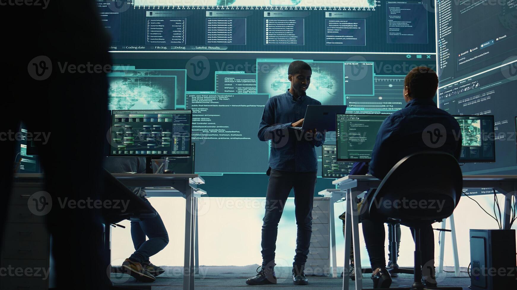 Group of governmental hackers analyzing digital threats on pc networks, using a big screen. Specialists working on collecting information, fighting against cybercrime and cyberterrorism. Camera B. photo