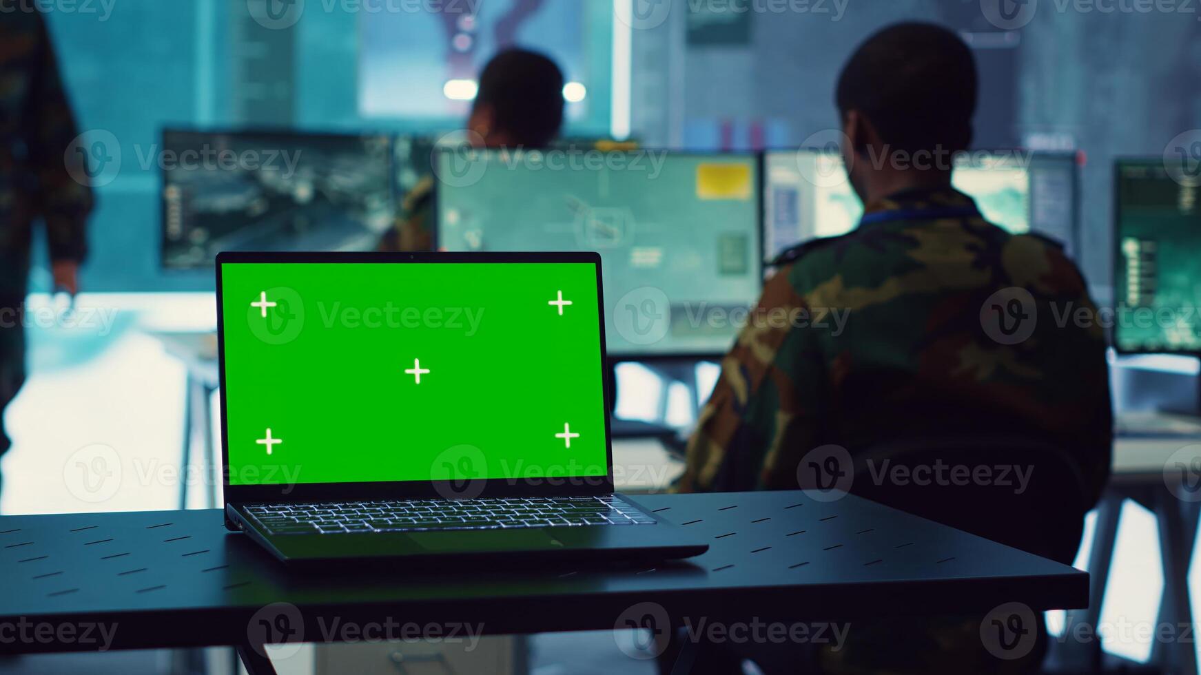 Greenscreen running on a laptop in military base command center, team of army officers monitoring coast line activity to ensure national safety. Soldiers detecting suspicious vessels. Camera A. photo