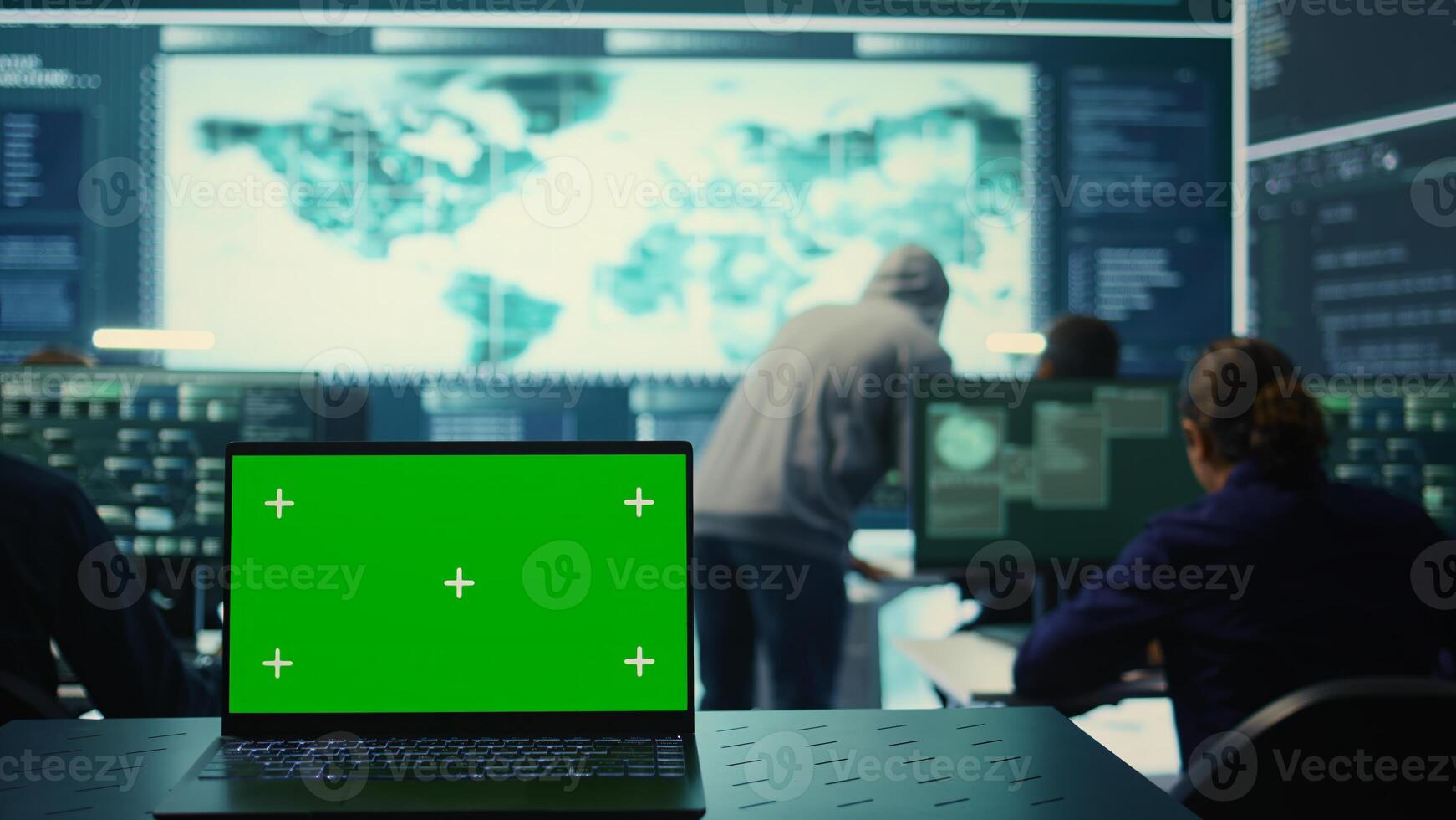 Laptop showing green screen in a governmental high tech office, cyber security team working on network security and data protection. Focusing on ransomware and other cyber threats. Camera B. photo