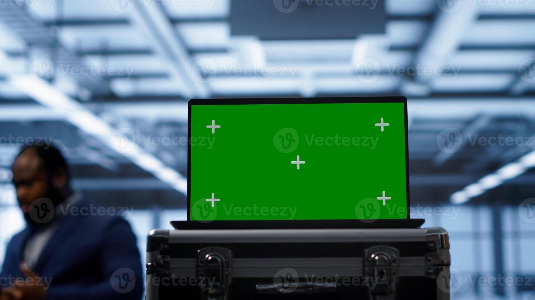 Green screen laptop used by engineers monitoring server room, doing checkup. Focus on chroma key notebook used by IT support employee working in data center facility, camera A close up photo