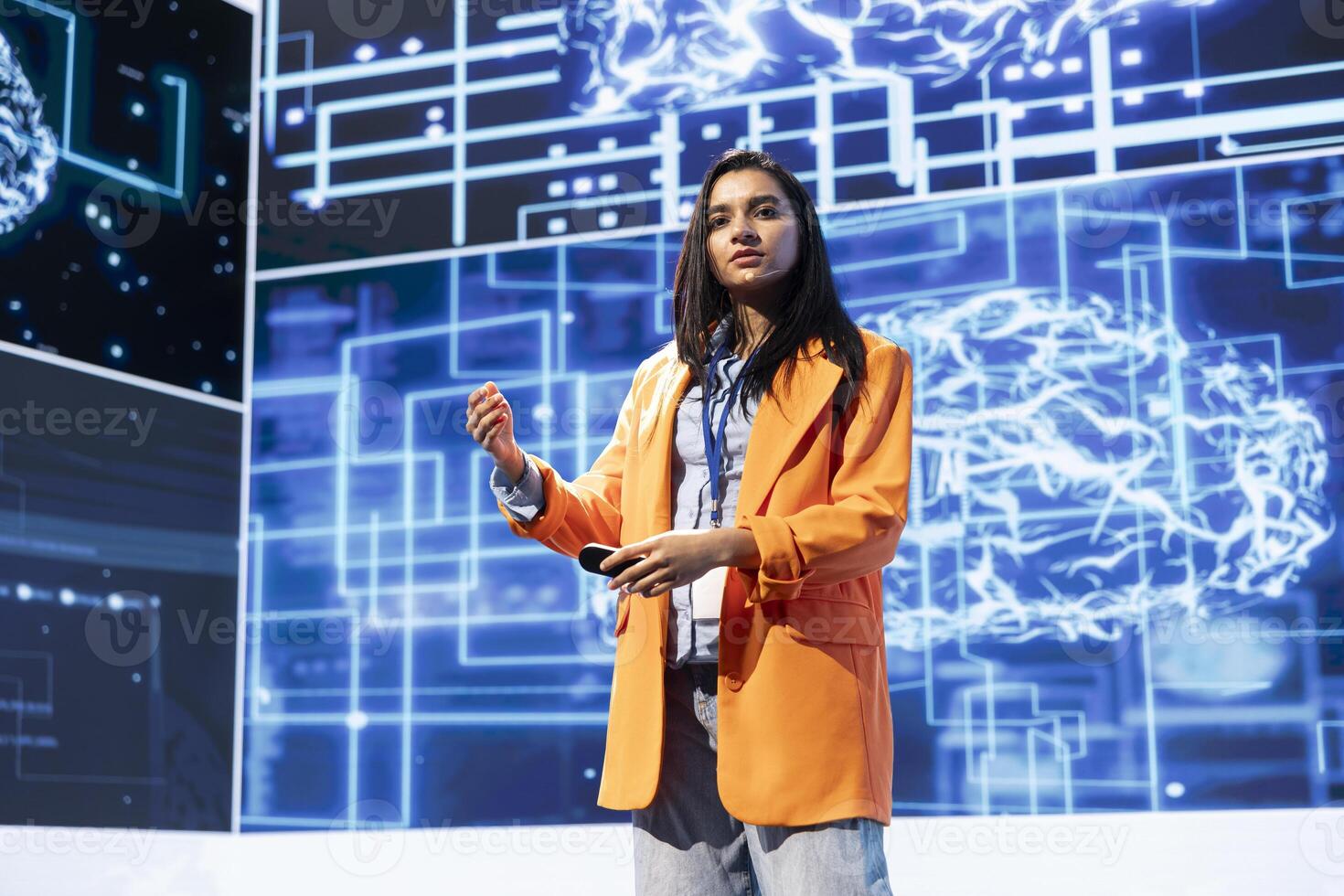 Technician presenting how artificial intelligence technologies can bring businesses increased productivity during IT expo. Expert talks about implementation of AI driven solutions during tech forum photo