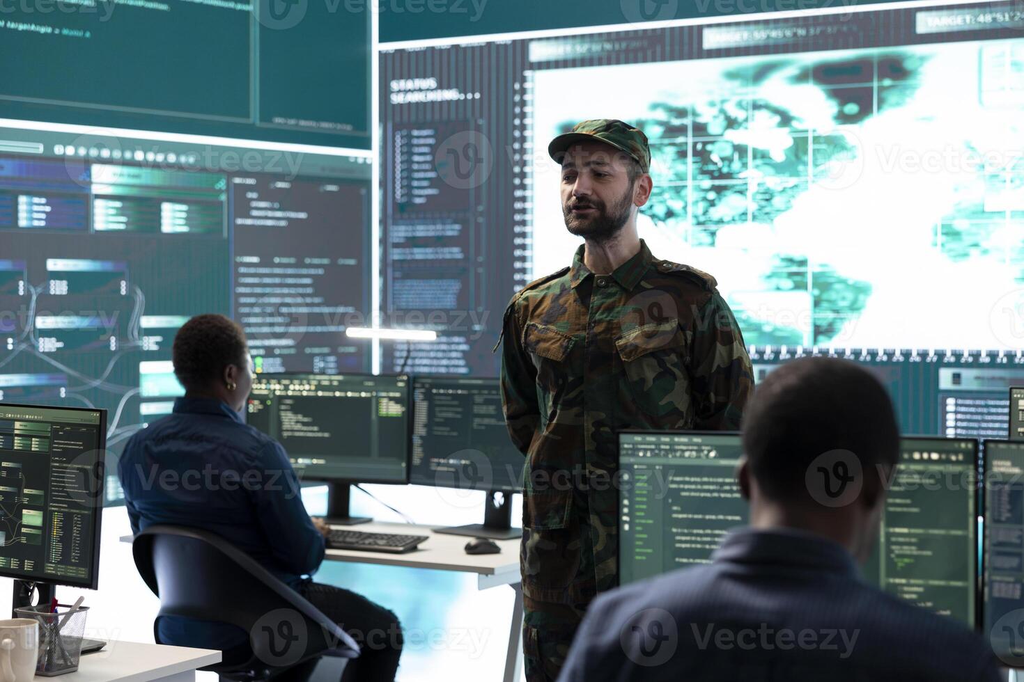 Military personnel working in a government cyber defense center, cyber attack prevention. Soldiers team securing sensitive data from spyware, ransomware and other malware threats. photo