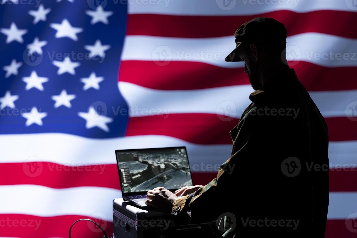 CIA agent isolated over United States flag combating organized crime and terrorism using detection system on notebook. American officer protecting territorial integrity by tracking terrorists photo