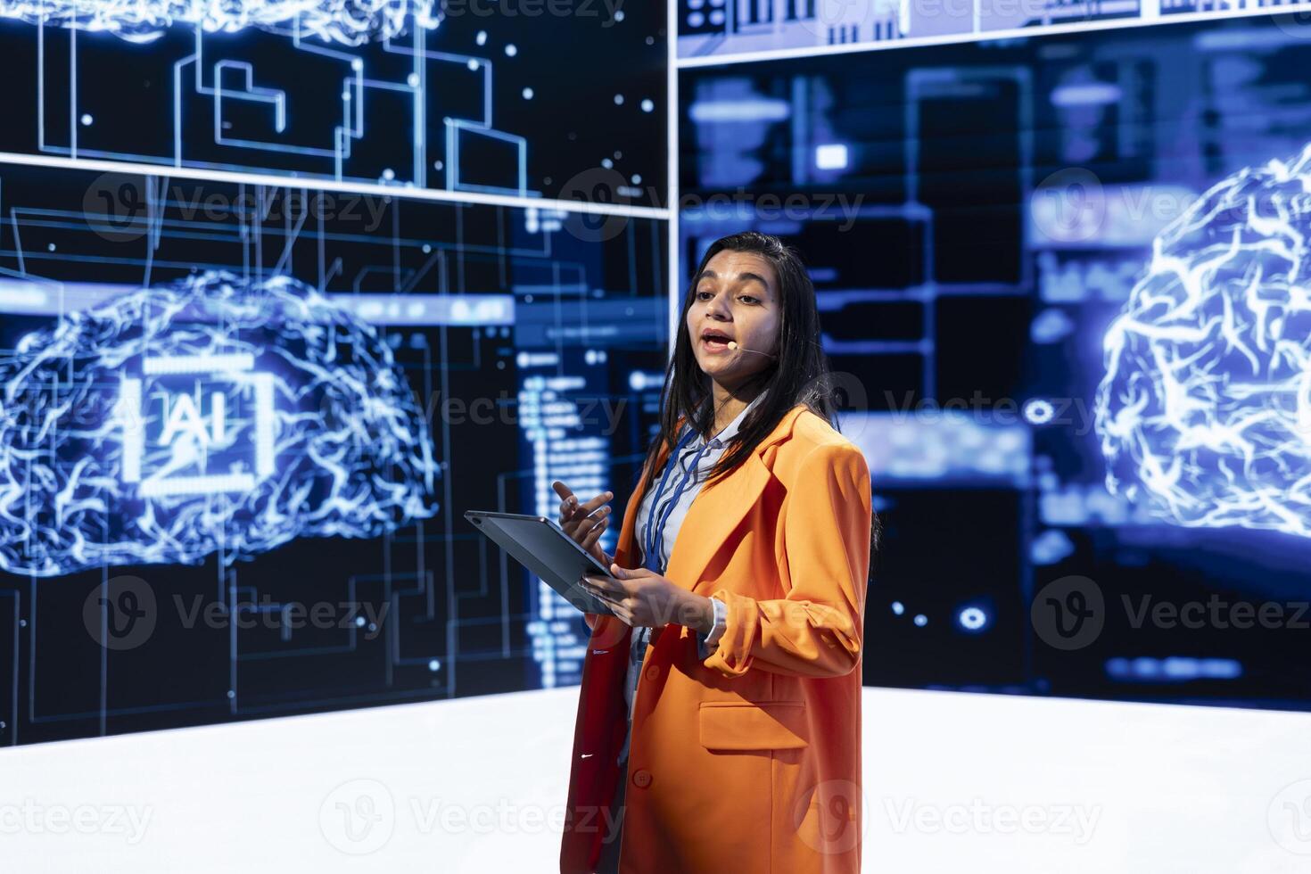 Speaker does presentation during tech corporate event, exploring successful implementation of AI in driving forward startup businesses, sharing latest machine learning discoveries photo