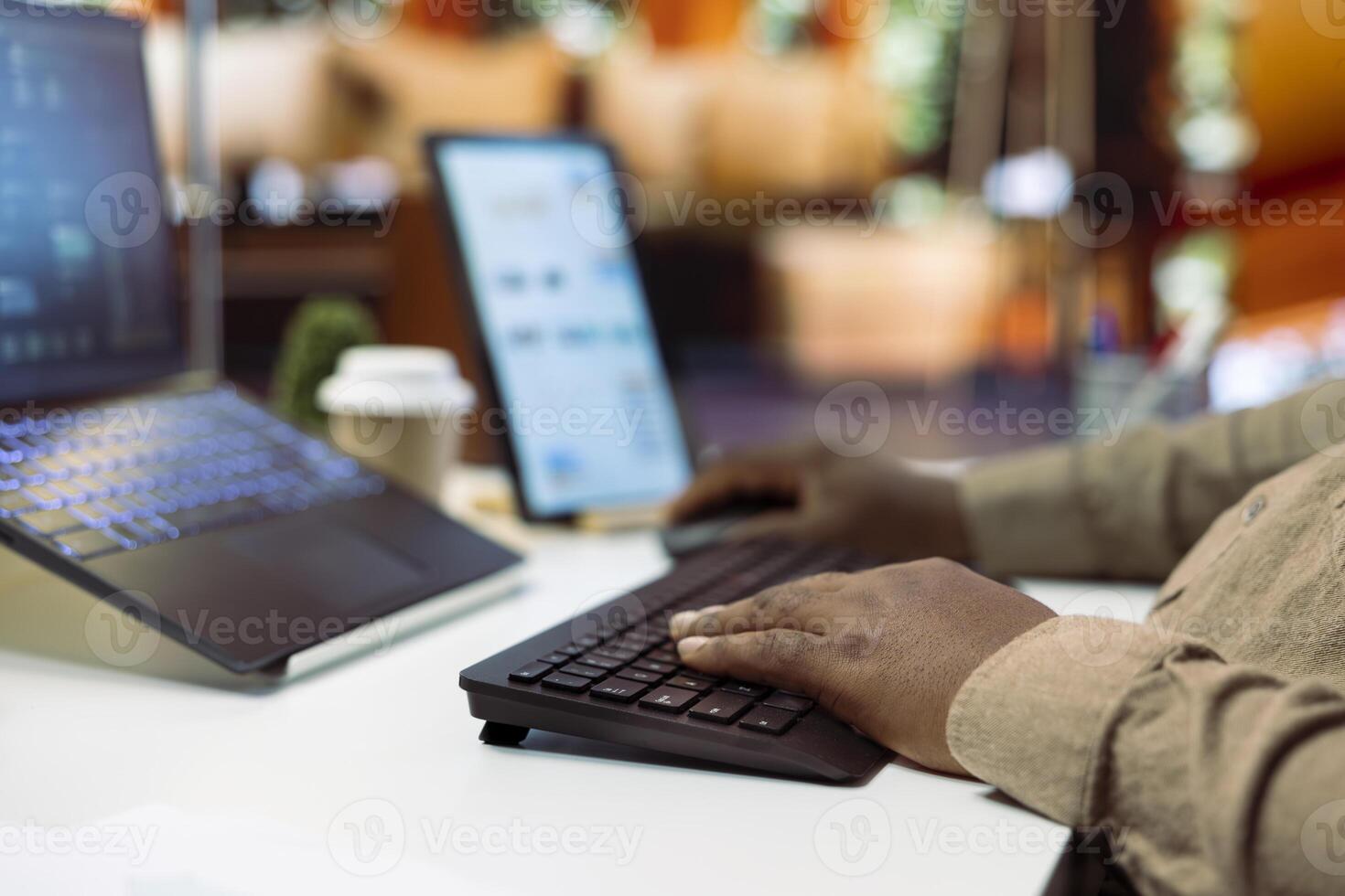 AI software developer creating an algorithm for deep learning and data mining, coding on his laptop at home office. Expert processing binary code on supercomputer neural network. Close up. photo
