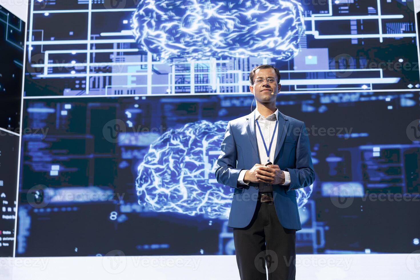 Portrait of jolly presenter speaking at tech conference, exploring latest AI technology trends and case studies. Joyous IT engineer presenting artificial intelligence products during event photo