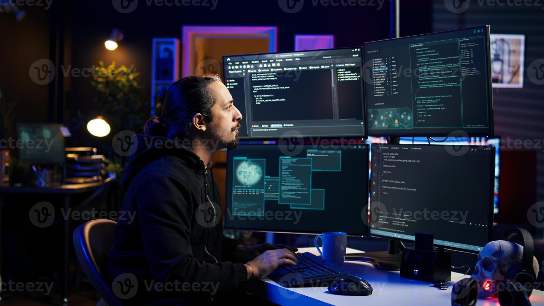 Hacker typing fast on keyboards, rushing to finish developing spyware software, using it to gather data from users computers without their knowledge. Scammer writing malicious code, camera B photo