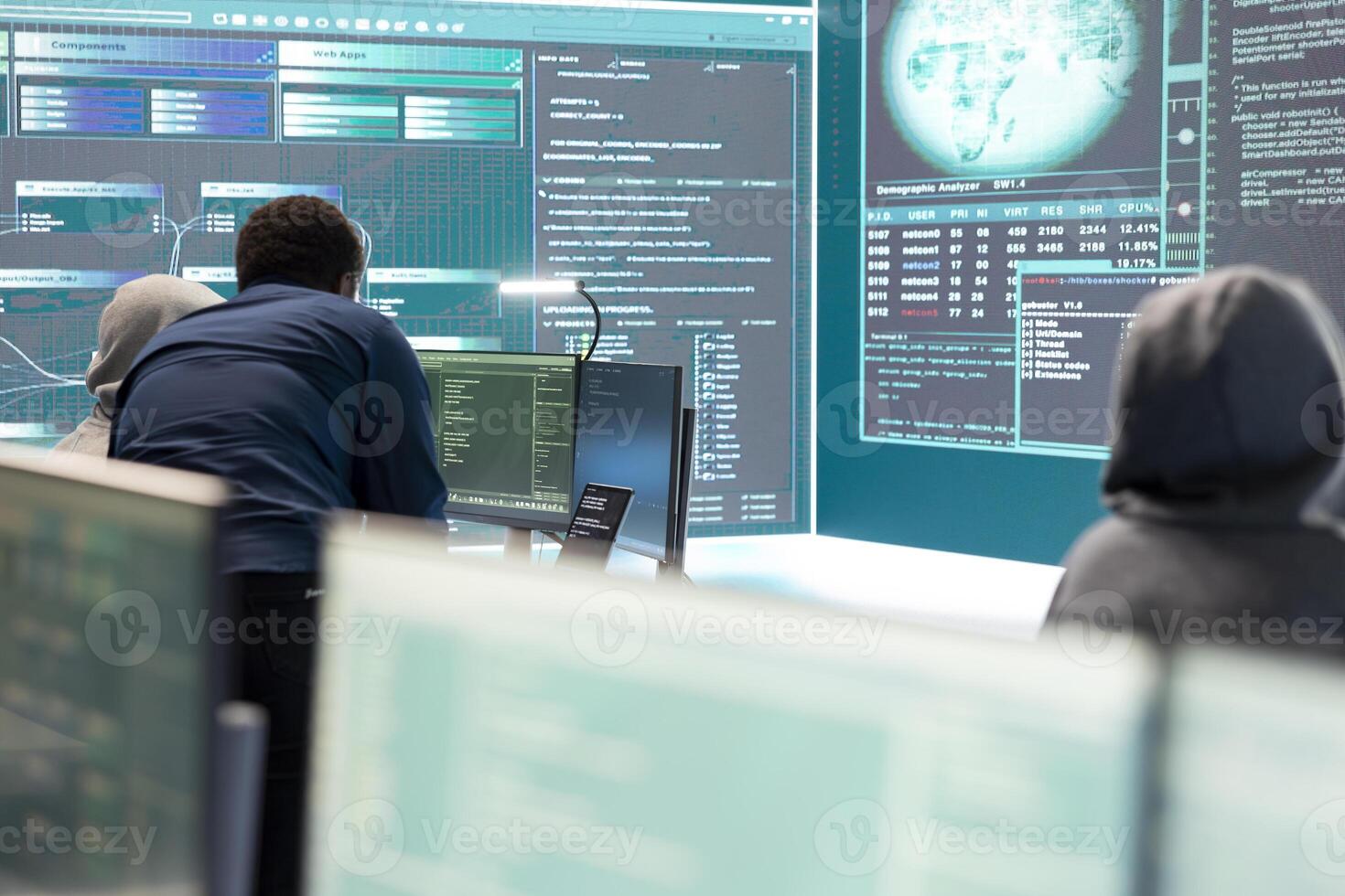Cyber intelligence specialist examines data on big screen in a governmental agency, focusing on cyber defense and protection against cyber attacks. Private information in hybrid war. photo