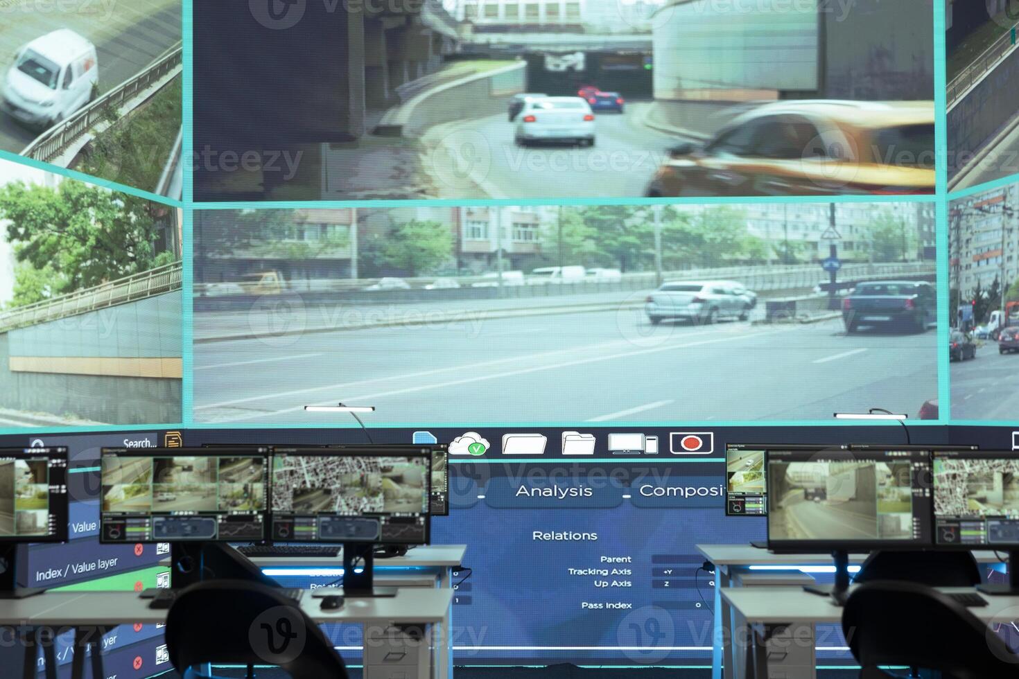Empty monitoring room full of workstations used to observe traffic surveillance footage on CCTV security cameras around the city. Agency using government satellite radar for public safety. photo