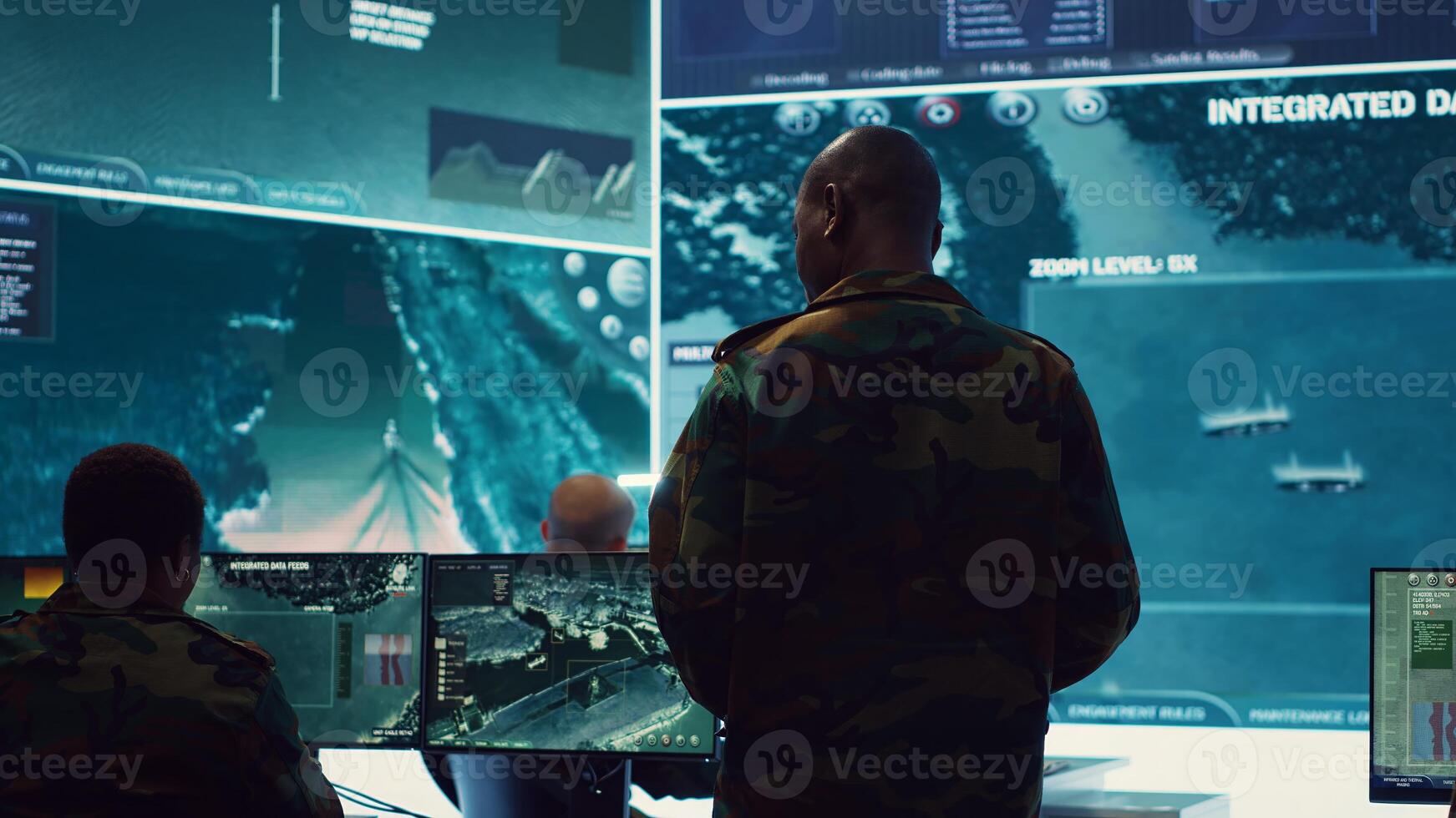 Commander and his crew operating radar systems via CCTV and satellite to detect and track enemy aircraft or missiles. Military officer uses big screen in control center to guarantee safety. Camera A. photo