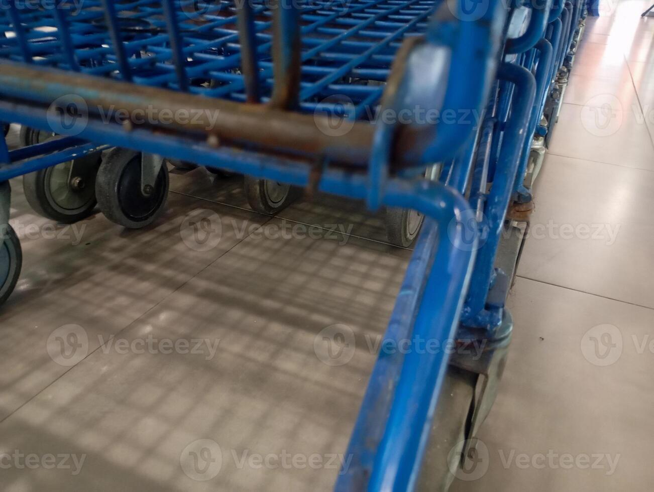 photo of a row of cart trolleys in a supermarket