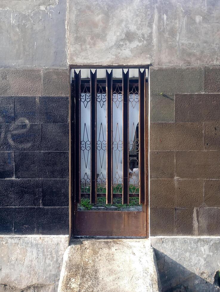 photo of the iron grille door of an old house