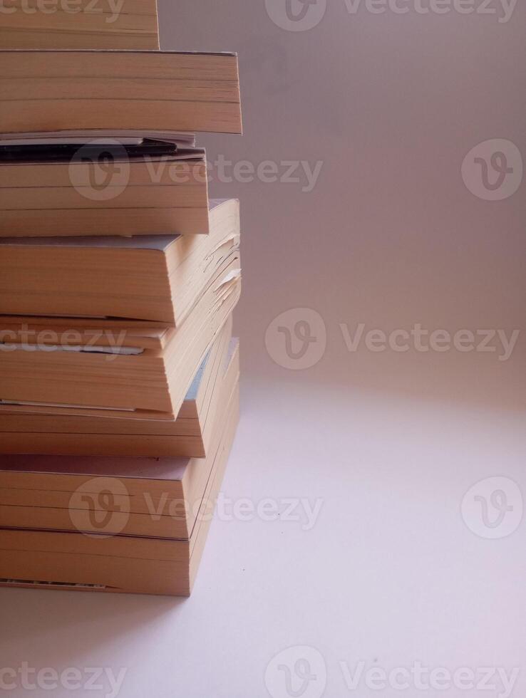 photo of a stack of books that have started to yellow